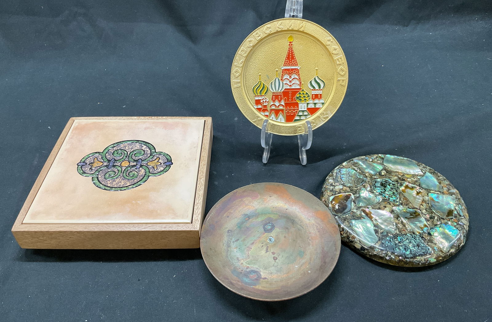 Lot 4 Decorative Home Accessories: Lot of 4 items. Decorative ceramic tile in wooden box. Marked on underside, reads as follows Leo D. Lipman. Ornate symmetrical design with swirled patterns. Features green, yellow, brown, and purple.