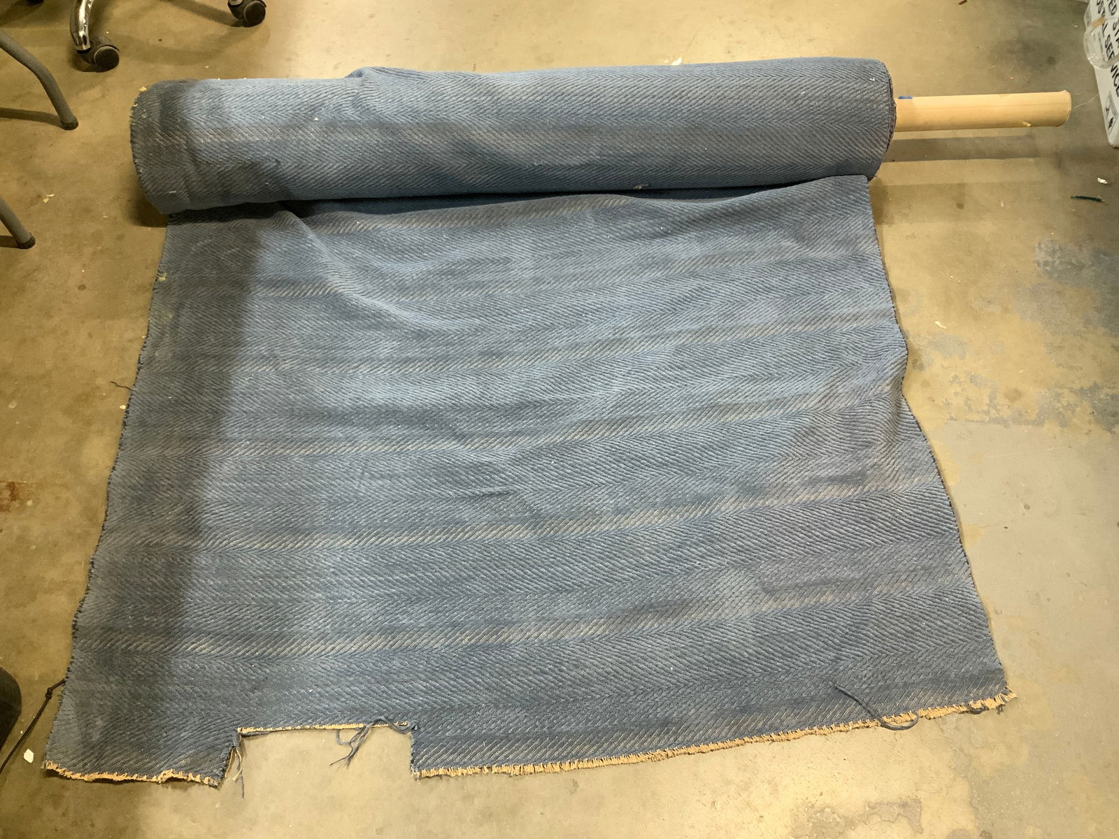 1995 Brunschwig & Fils Chenille Style Fabric Roll: Piece has weight. Fabric roll has a blue tone & a chenille style pattern. Fringed ends are cream toned. Lot is sold as is. Big roll of fabric. Appears to be possible synthetic. Signed & marked. Tag re