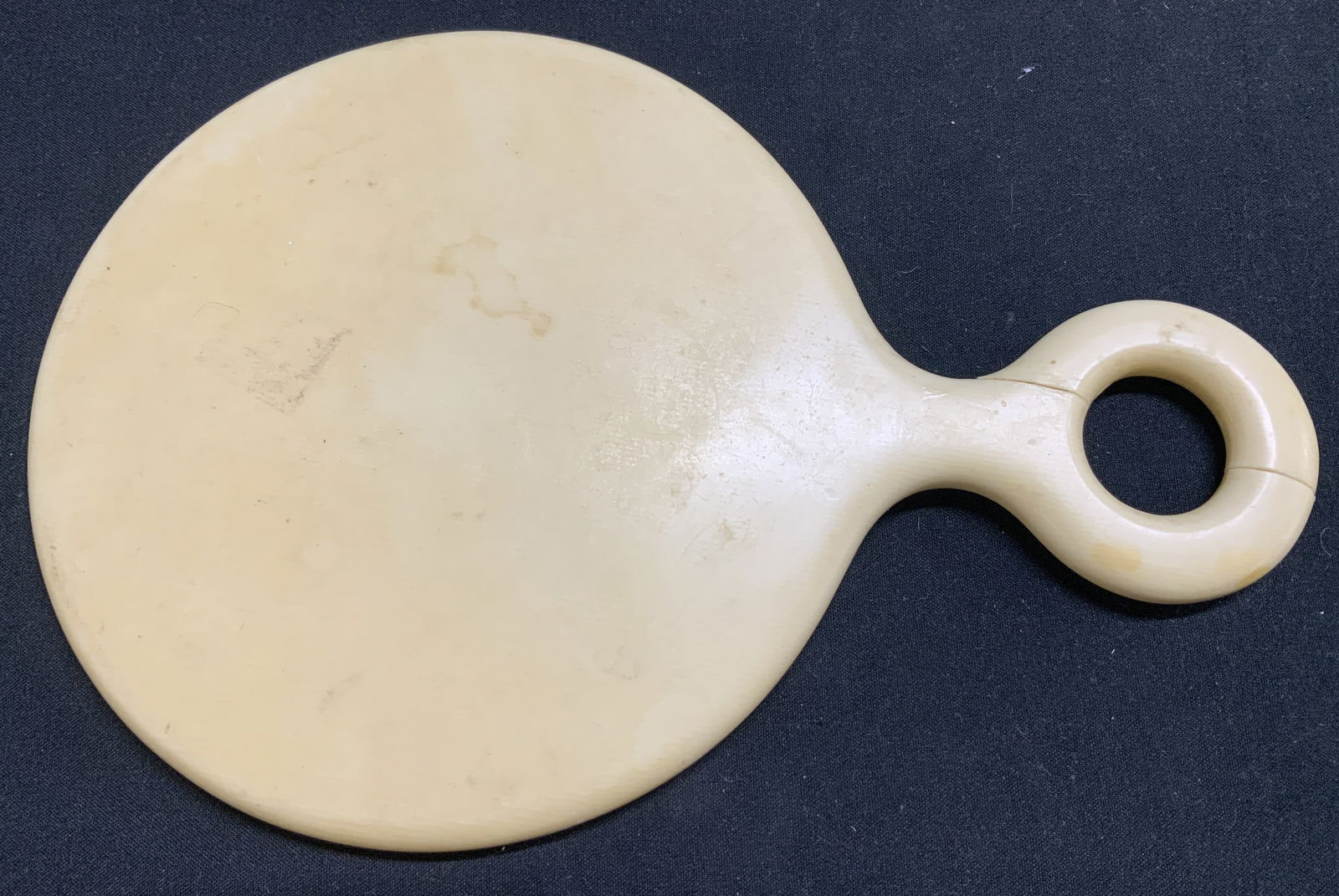 Vtg Parisian Lonnen Hand Mirror FRANCE: Vintage Parisian Lonnen hand mirror, handle that features a circle opening. Signed & marked. Reads, TRADE PARISIAN LOONEN IVORY FINISH MARK FRANCE. Surface wear consistent to age, use & exposure. Meas