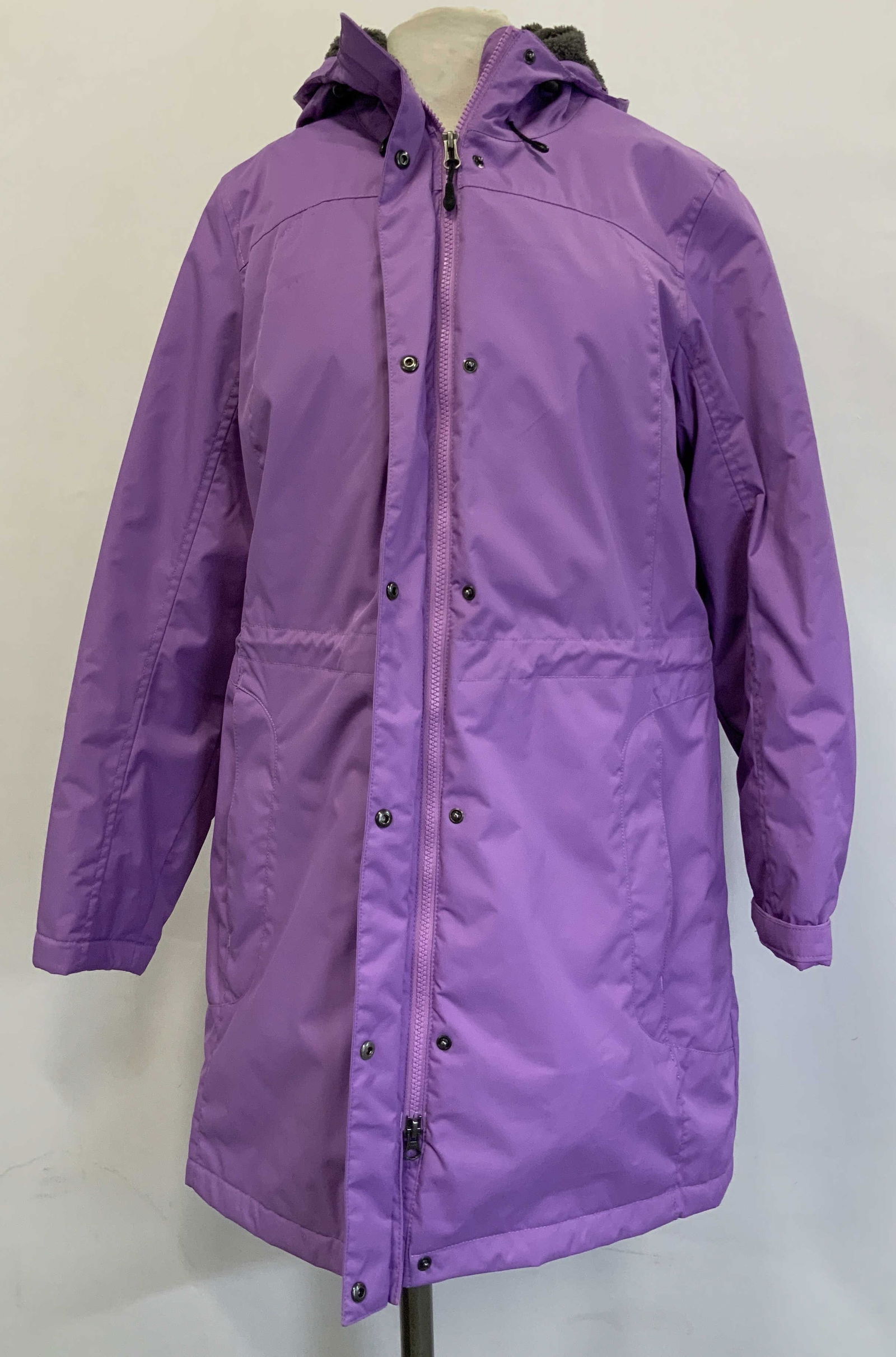 L.L. Bean Purple Hooded Long Parka BANGLADESH: Parka is size M Reg. Shell is 100% nylon & interior is 100% polyester. Made in Bangladesh. Purple finish with a full zip & snap closure. Hooded & pockets. Interior has a fleece lining. Signed & marked