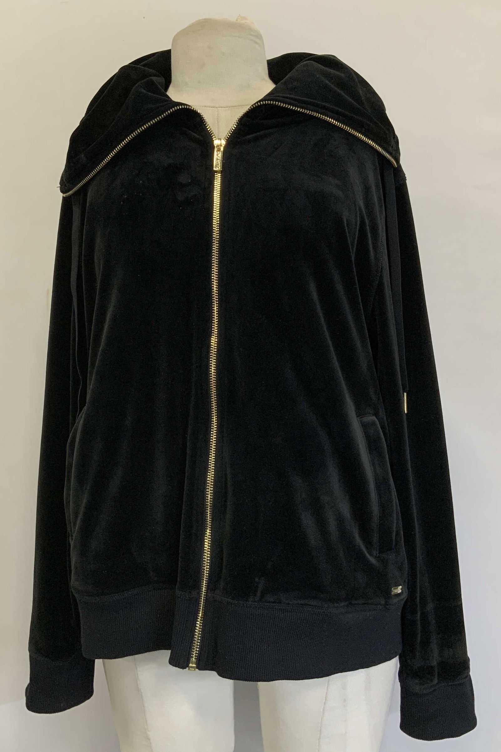 Calvin Klein Black Velour Hooded Jacket: Calvin Klein jacket is size large. Body is 95% polyester & 5% spandex. Velour style. Features gold toned hardware & side pockets. Drawstrings details. Signed & marked. Reads, CALVIN KLEIN. Surface wea