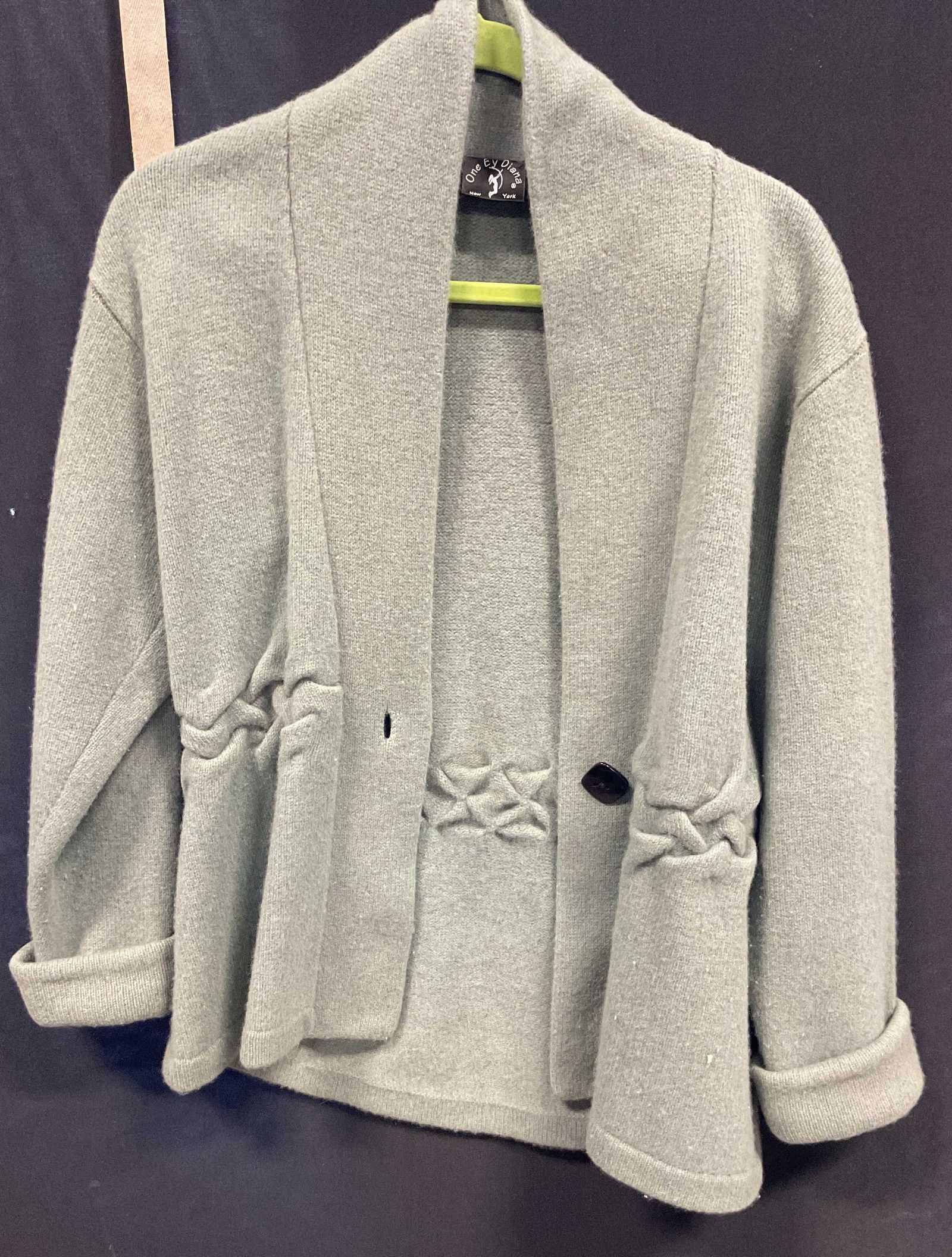 One Ey Diana Blue Sweater Cardigan: One Ey Diana New York blue sweater cardigan. Feels like wool. Measures approx 17 inches across chest. Collared cardigan. Rolled sleeves. One black button in front. Ribbed design. Wear consistent with