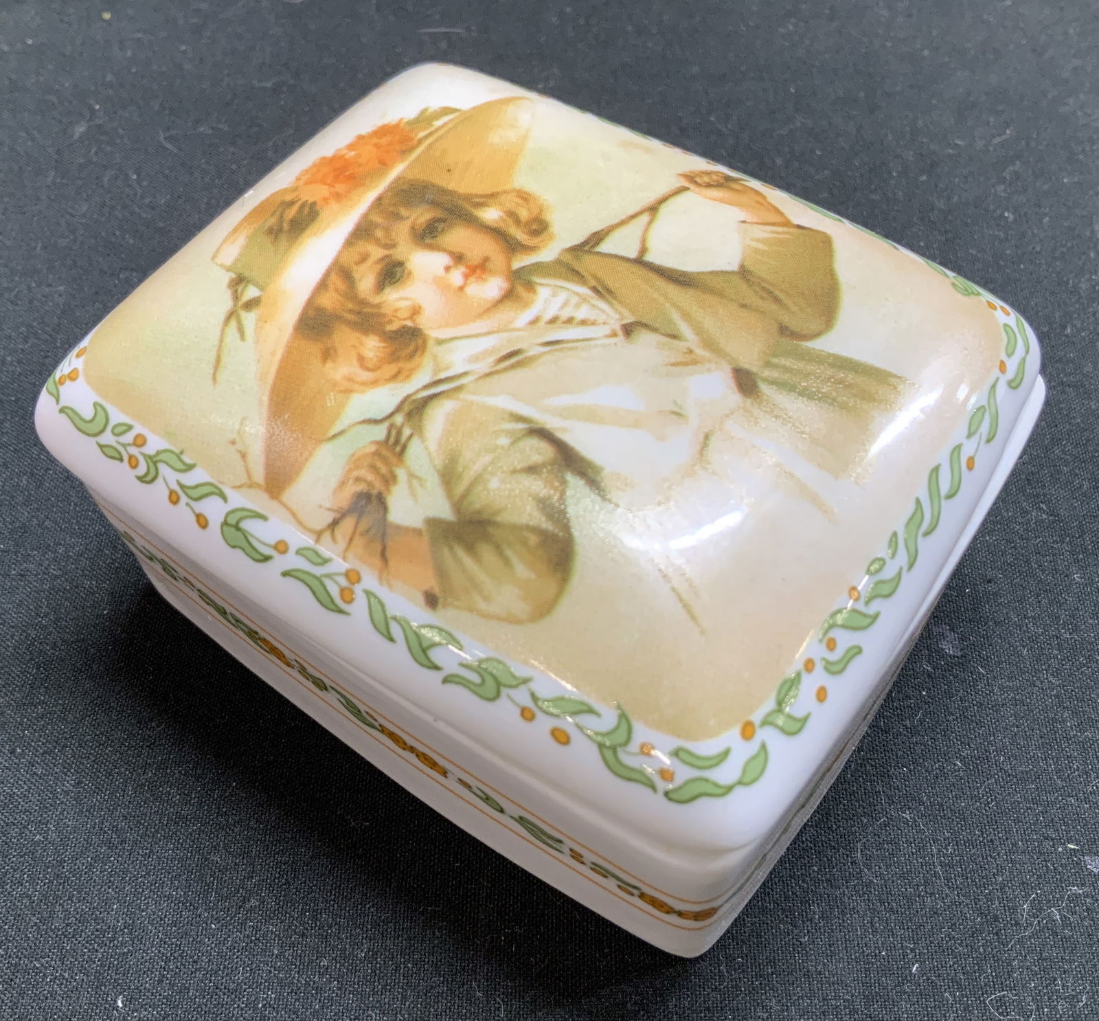 1991 Maud Humphrey Autumn Days Porc Music Bx: 1991 Maud Humphrey Bogart Autumn Days porcelain music box. It is part of The Heirloom Tradition collection. Music box features an image of a child. Signed & marked on underside. Reads, Porcelain Music