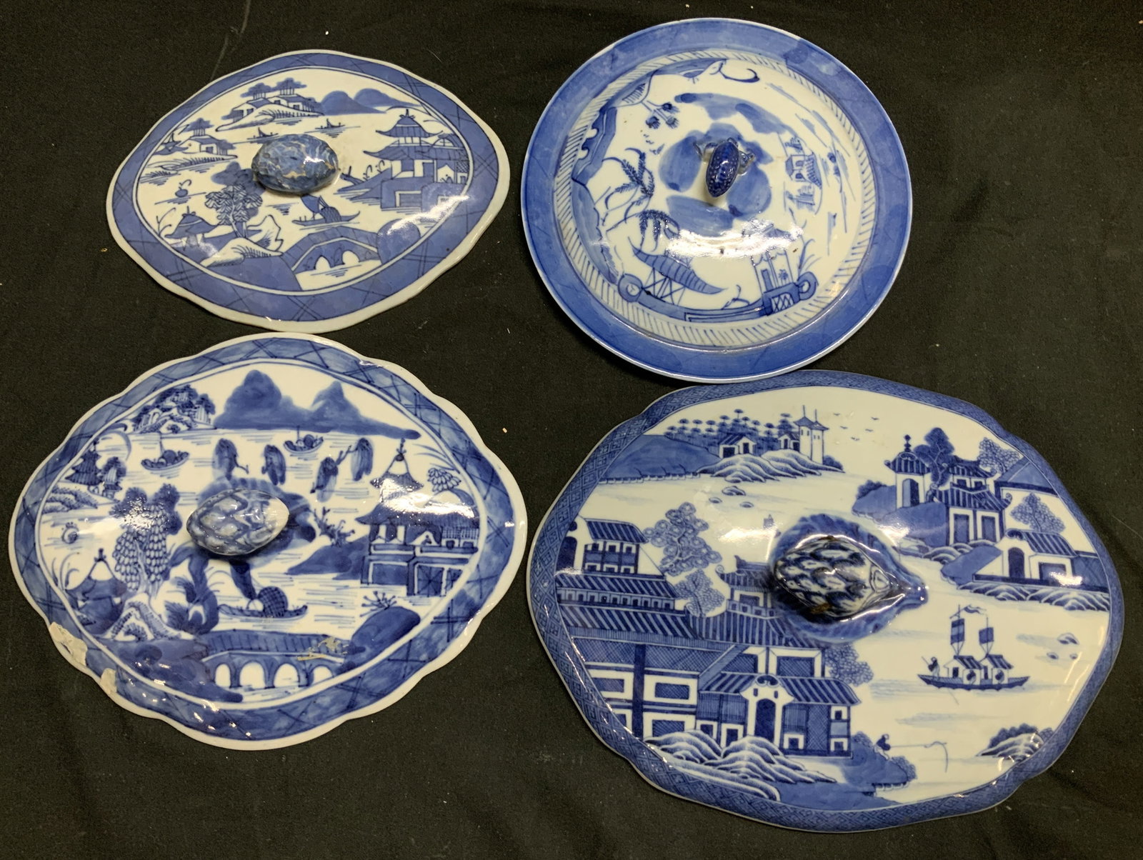 Lot 4 Vtg Blue & White Scenic Porcelain Lids: Lot includes, 4 vintage blue & white porcelain lids. Lids feature scenic/landscape motifs. Houses, trees, boats, figs & more. Lids have finials. Assorted sizes & shapes. Lot is sold as is. Surface wea