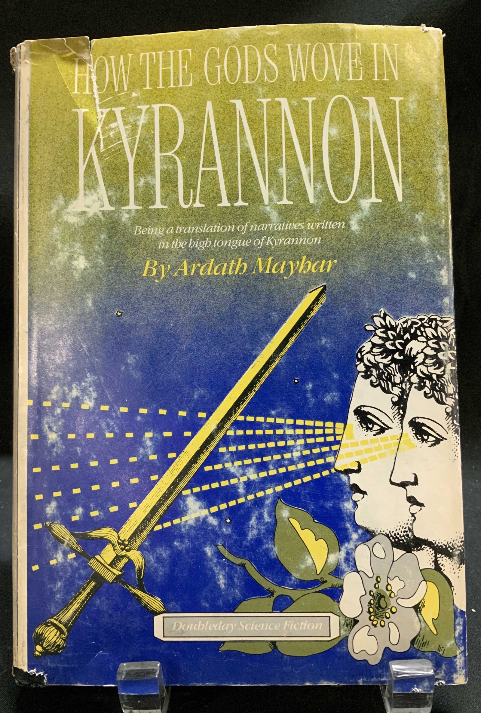 1979 How Gods Wove in Kyrannon 1st Ed Ardath MAYHAR: How the Gods Wove in Kyrannon by Ardath Mayhar. Doubleday & Company INC. Garden City, NY. First Edition. Copyright 1979. Printed in the USA. Front cover features science fiction illustrations. Surface