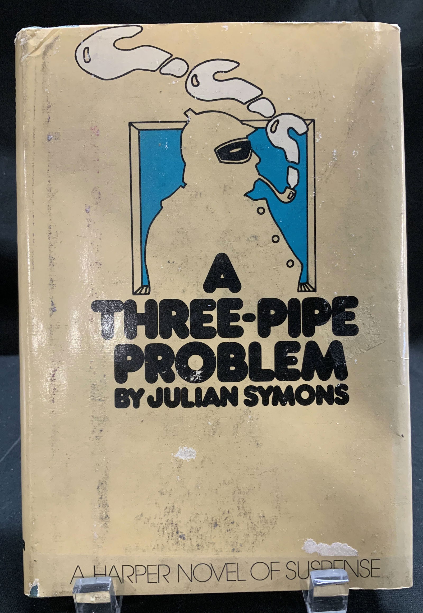 1975 A Three-Pipe Problem 1st Ed Bk Julian SYMONS: A Three-Pipe Problem by Julian Symons. Harper & Row, Publishers. Copyright 1975. First U.S. Edition. Printed in the USA. Front cover is tan toned & features a figure smoking. Surface wear consistent t