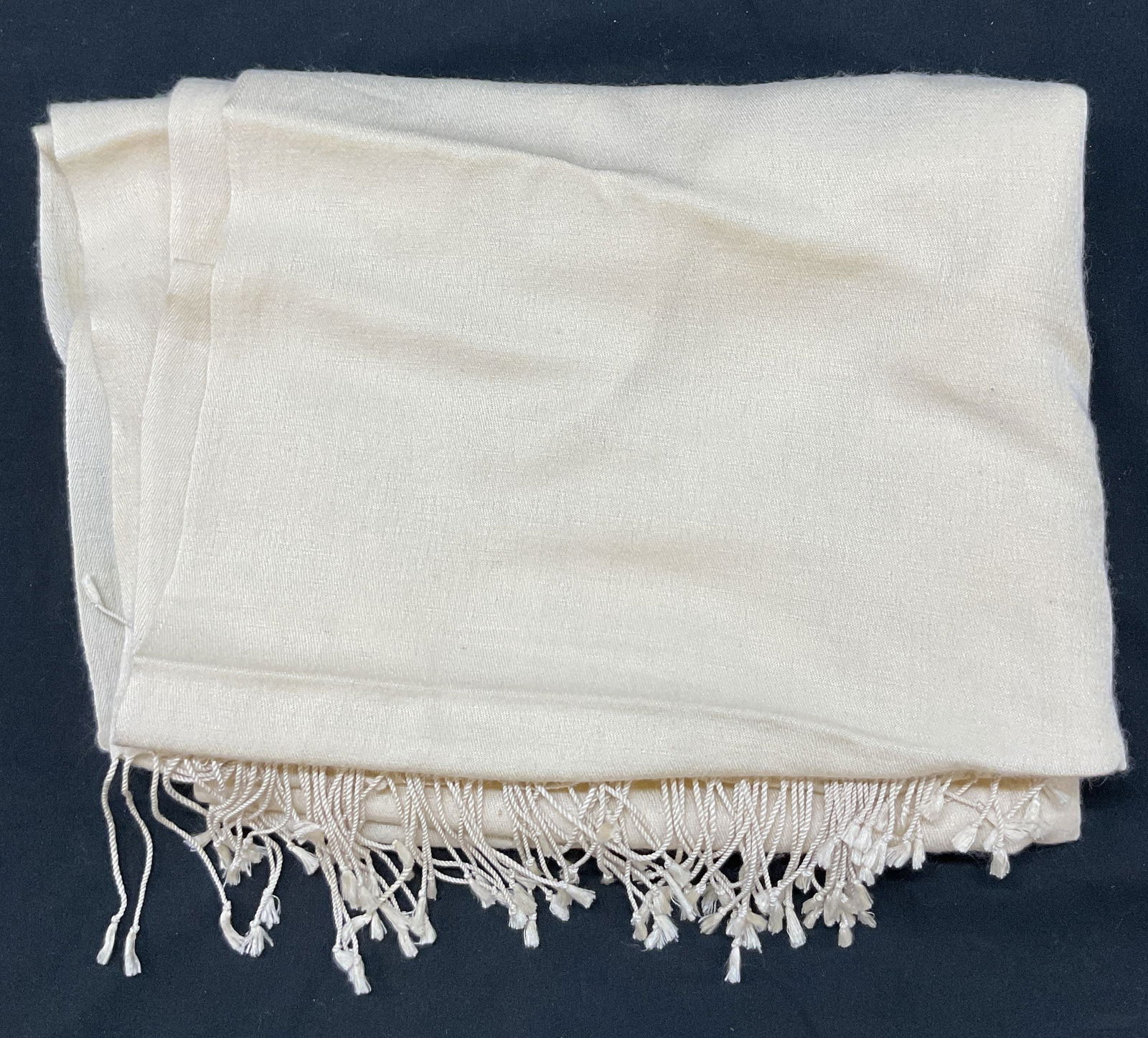 Vintage Cream Fringed Scarf: Vintage cream colored fringed scarf. Feels like cotton. Cream fringed trim. Measures approx 36 x 42 inches. Some blemishes and wear consistent with exposure. Scarf, fringed scarf, vintage scarf, women