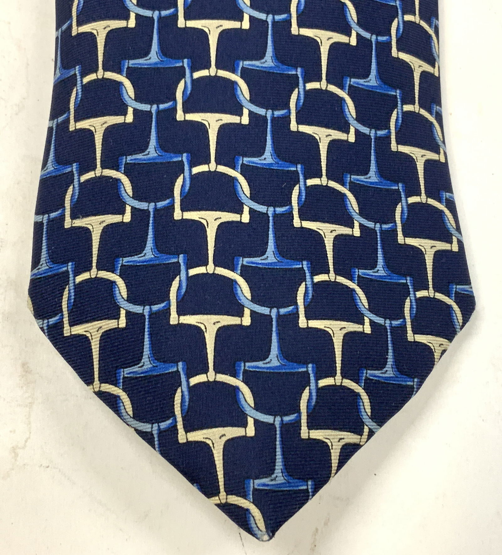Burberrys Blue & Tan Geometric Silk Tie ENGLAND: Necktie is 100% silk & features a repeating geometric pattern. Shades of blue & tan. Signed & marked. Reads, BURBERRYS. MADE IN ENGLAND. Surface wear consistent to age, use & exposure. Measurements: l