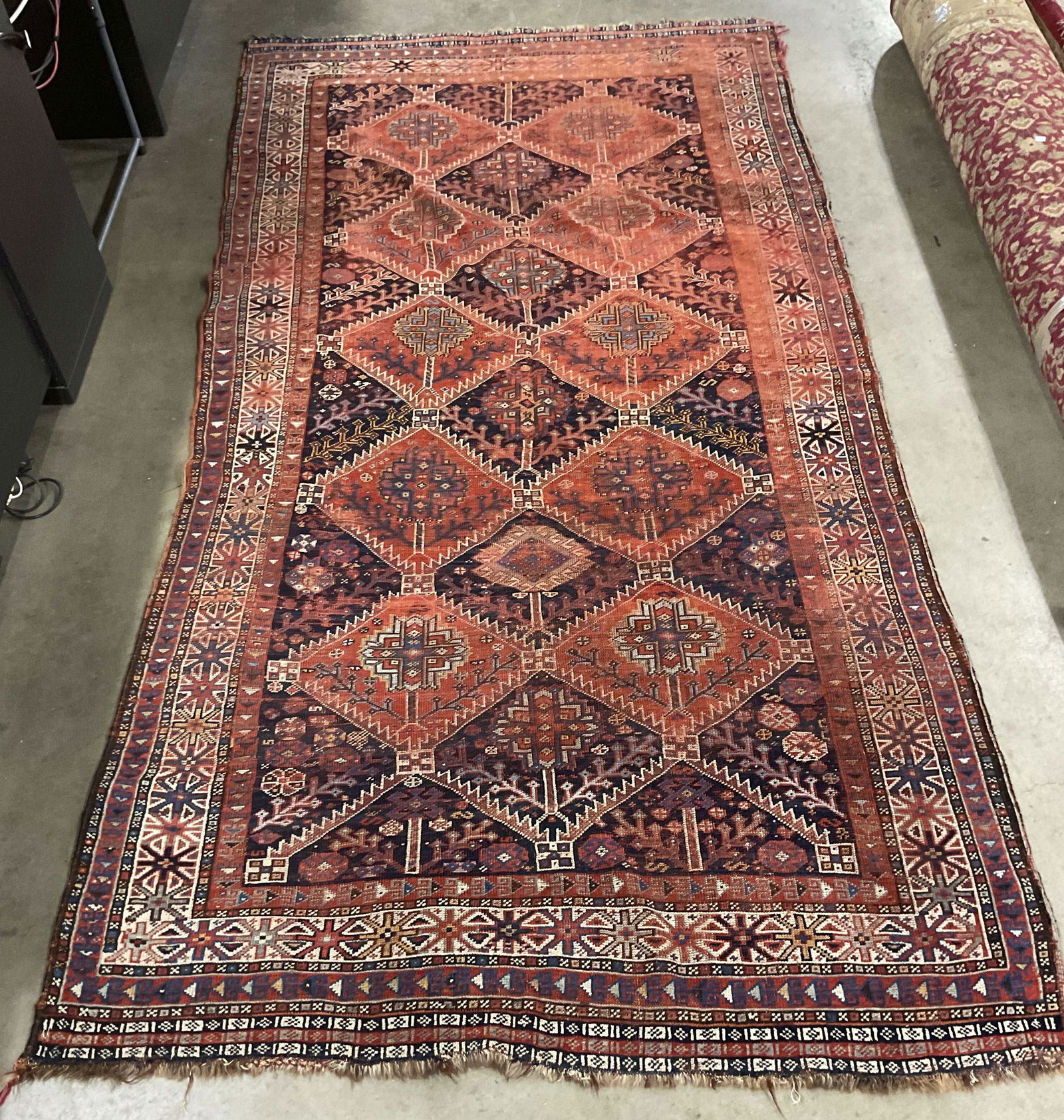 Vintage Turkish Style Wool Kilim Area Rug: Vintage Turkish kilim style wool area rug, tribal style medallion pattern with intricate floral botanical border in red and blue. Measures approx 113 x 57 inches. Some discoloration and fraying. Turki