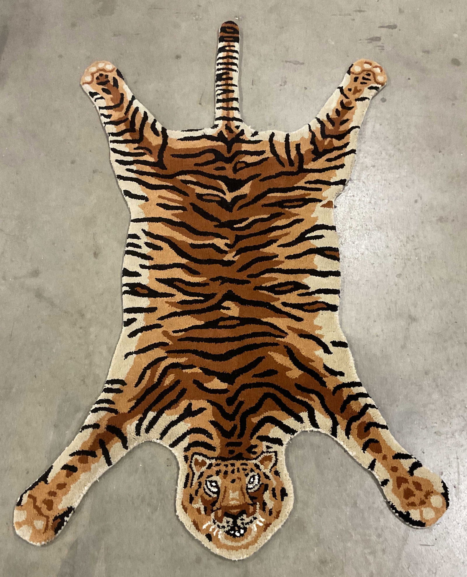 Hand Tufted Wool Tiger Motif Area Rug: Hand tufted wool area rug. Tiger motif. Tan, brown, orange. Measures approx 3 x 5 feet. Some wear consistent with exposure. Tiger rug, wool rug, area rug, home decor, home accessories, rug, 10 rs