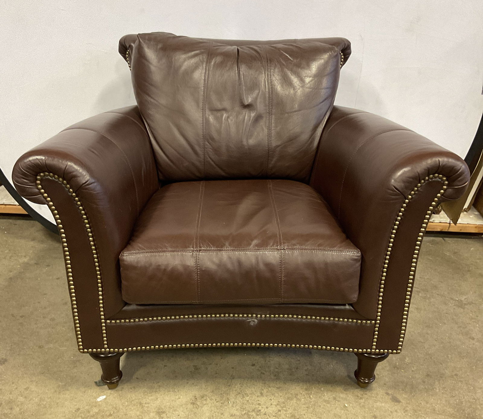 Chaddock Surrey Brown Leather Nailhead Armchair: Chaddock Living armchair. Surrey pattern. Brown leather with nailhead trim. Measures approx 40.5 x 34 x 34 inches. No signature. Some scratching and rubbing to leather. Leather chair, leather armchair