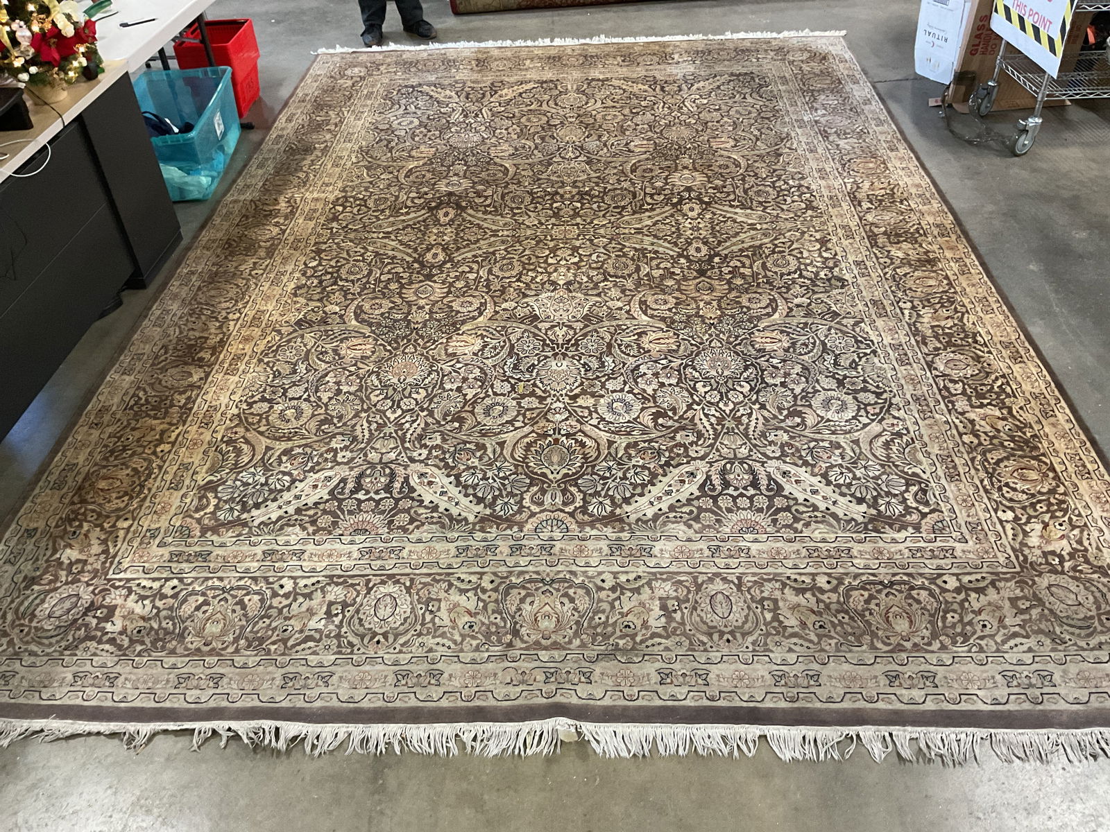Tan Intricate Floral Wool Room Size Rea Rug 174in: Tan intricate floral pattern wool area rug with fringe. Measures approx 174.5 x 121 inches. Wear including discoloration. Rug, area rug, room size rug, wool rug, floral rug, tan rug, home decor, home