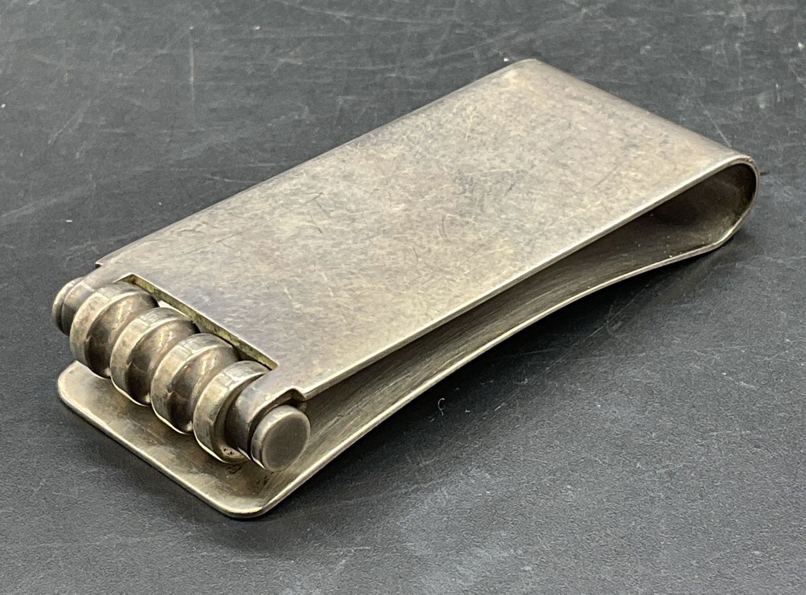 Tiffany Paloma Picasso Sterling Silver Money Clip: Tiffany & Co Sterling silver money clip designed by Paloma Picasso. Signed and marked sterling. Measures approx 2.25 x 1 inches. Total weight 34.4 grams. Some scratching. Tiffany and co money clip, Pa