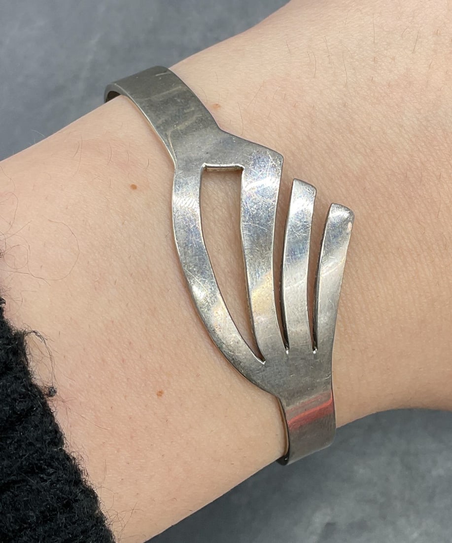 Sterling Silver Cut Out Cuff Bracelet, Mexico: Sterling silver cuff bracelet with cut out design band. Marked sterling. Made in Mexico. Measures approx 2.5 inches wide. Total weight 16.2 grams. Some scratching. Jewelry, estate jewelry, fine jewelr