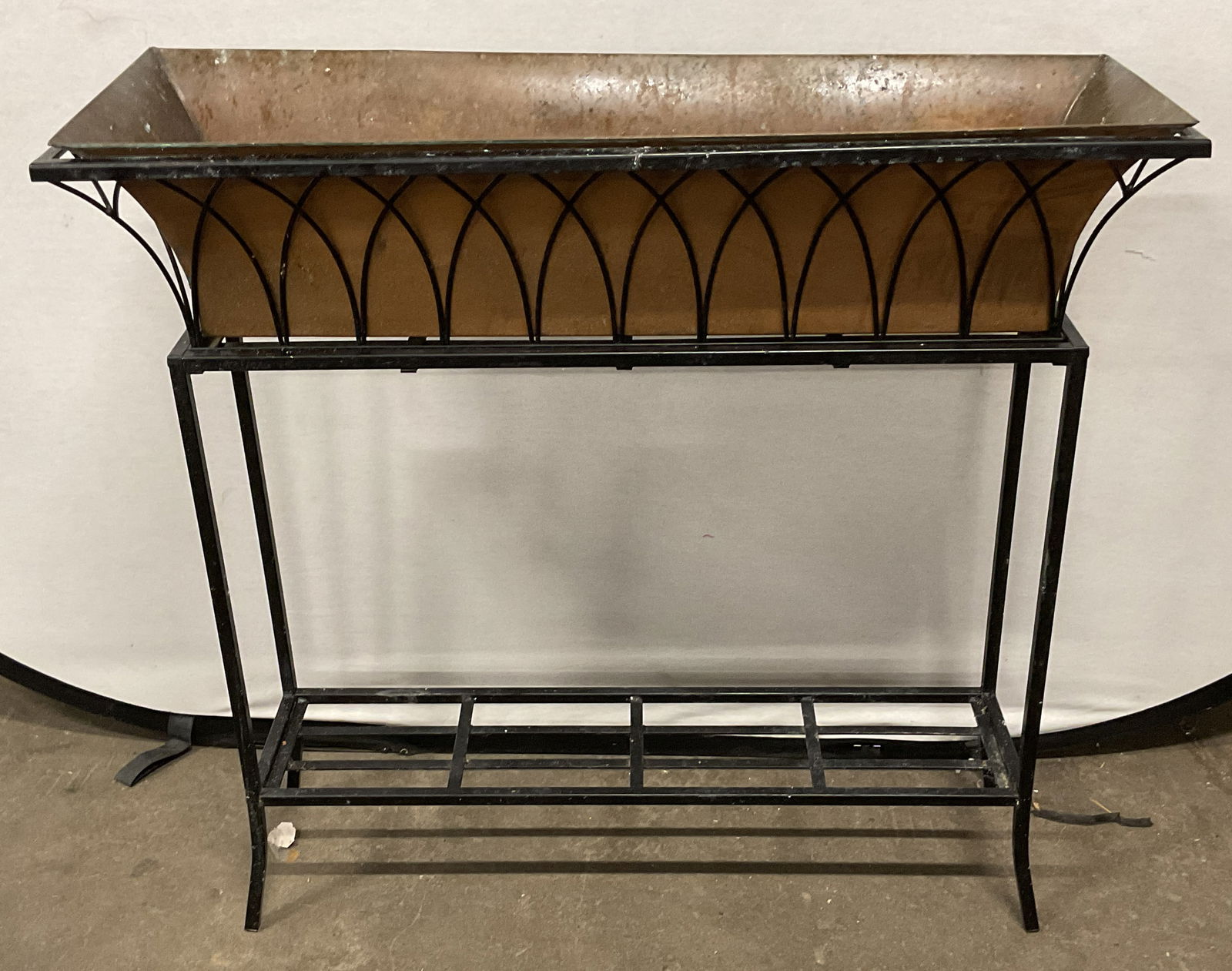 Black Metal & Copper Planter Plant Stand 3ft: Black metal frame plant stand with copper insert planter. Curved wire frame design. Measures approx 36 x 12 x 33 inches. Wear including patina and scratching. Planter, plant stand, black plant stand,