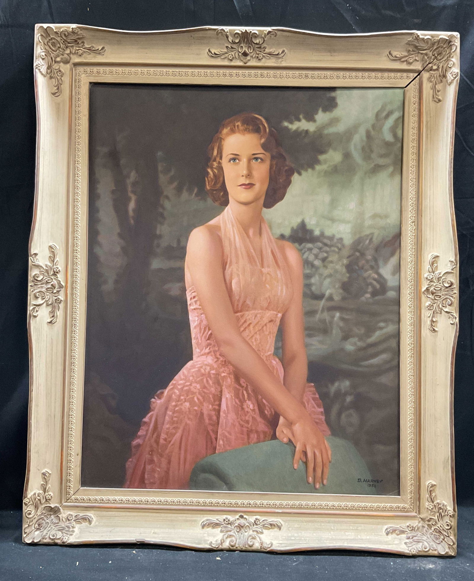 Signed B Harvey Portrait of a Woman Oil Painting: Framed oil on board painting. Signed and dated lower right, B. Harvey, 1956. Portrait of a woman wearing pink dress. Ornate white wood frame. Not examined out of frame. Frame measures approx 34 x 28 i