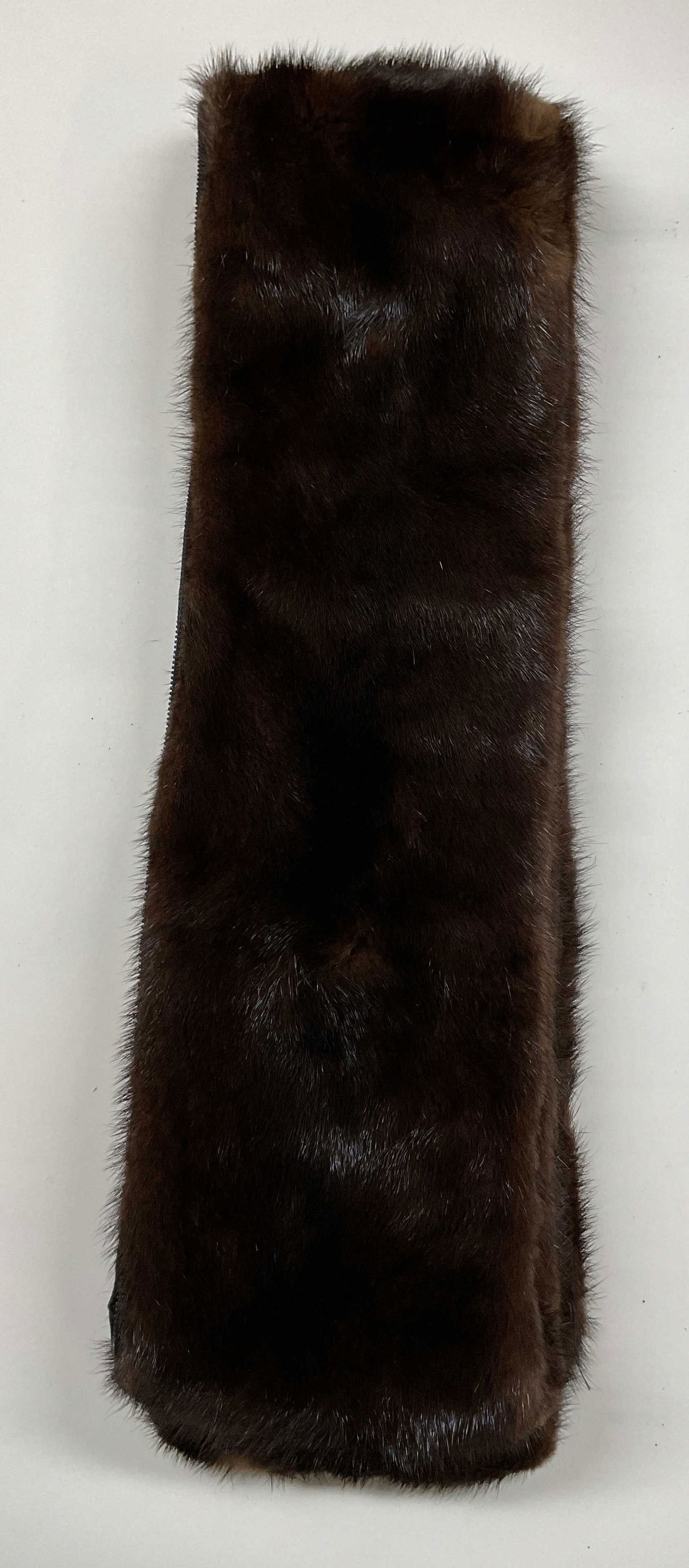 Vintage Long Brown Mink Fur Scarf: Vintage long brown mink fur scarf. Long rectangular shape. Geometric pattern lining. Zipper on side. Measures approx 5 x 69 inches. Wear consistent with exposure. Scarf, mink fur scarf, womens scarf,