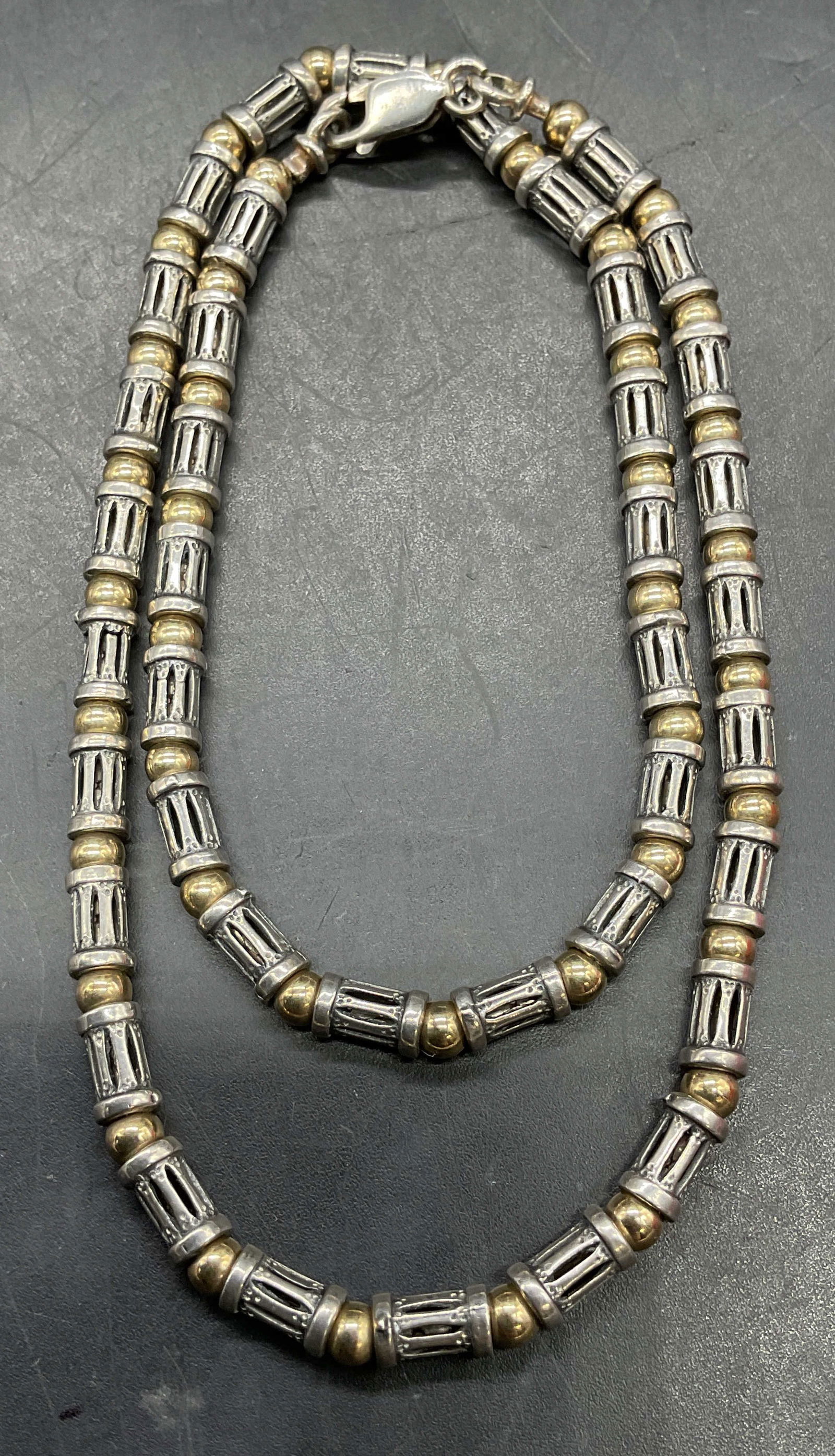 Sterling Silver & 14K Gold Beaded Necklace: Vintage sterling silver and 14k gold beaded necklace. Drop length approx 8 inches. Total weight 21.6 grams. Marked sterling. Tests for 14k gold using acid test. Some scratching. Jewelry, estate jewelr