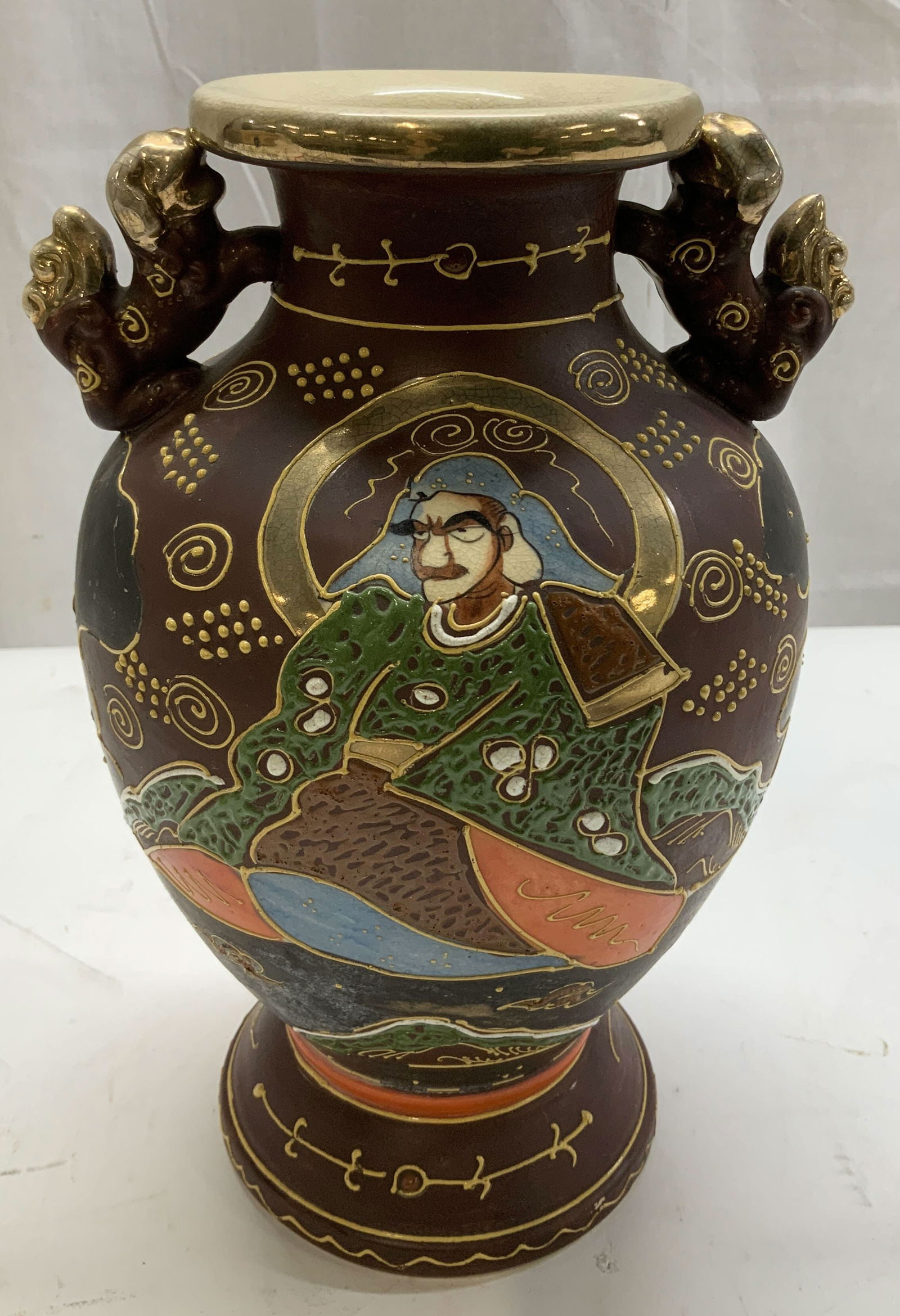 Vntg Japanese Satsuma Hand Painted Vase: Vintage Japanese Satsuma vase. Vase is ceramic & features hand painted illustrations of a possible samurai & nobleman. Intricate overglaze & gilt accents. Handles shaped like foo dogs. Property of ope