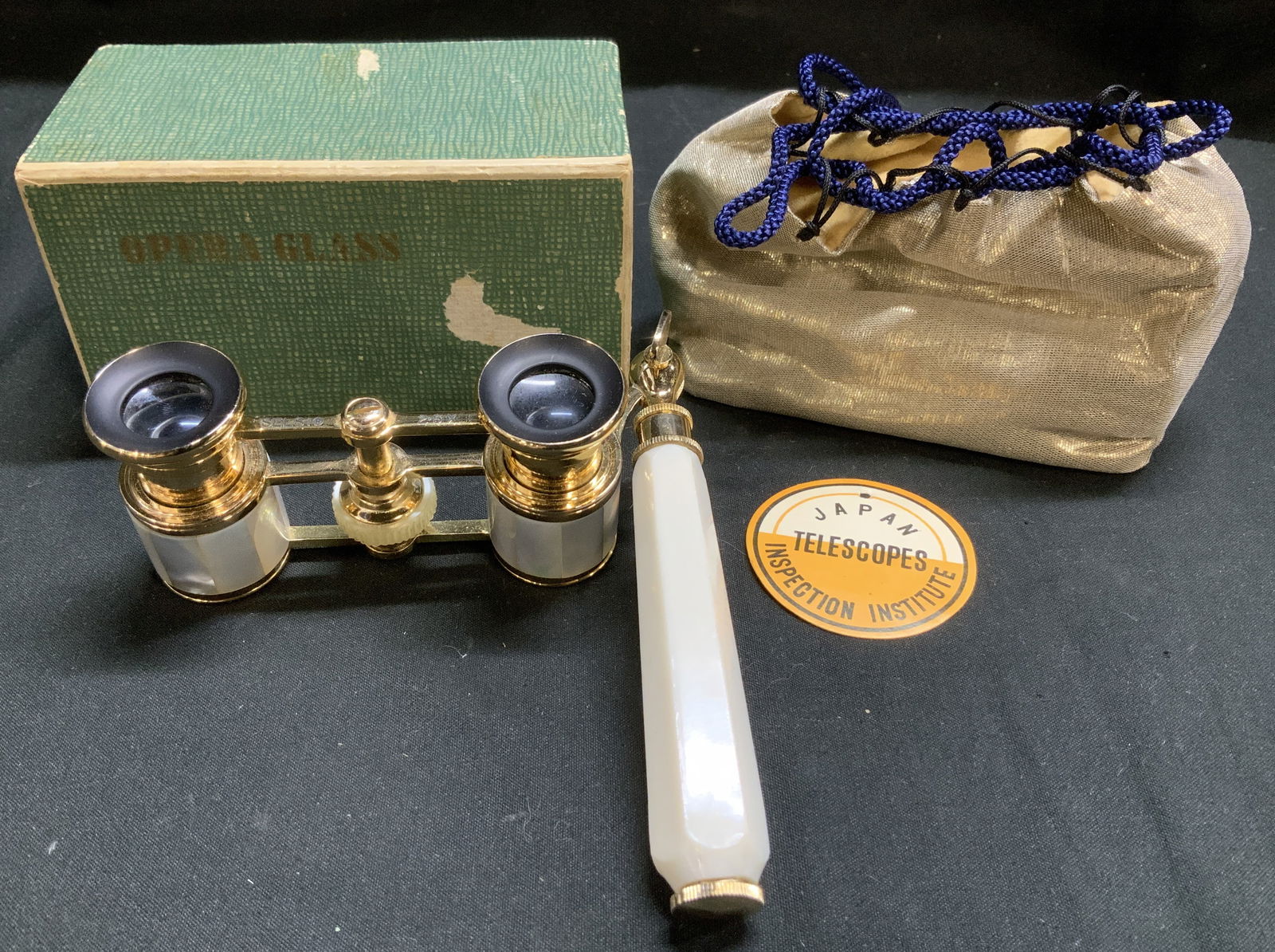 Vtg Selsi Mother of Pearl Opera Glasses JAPAN: Lot includes, Selsi opera glasses with a handle, featuring gold toned and mother-of-pearl accents. The magnification is indicated as 2.5x. Glass lenses & foldable/adjustable handle. Comes with opera g