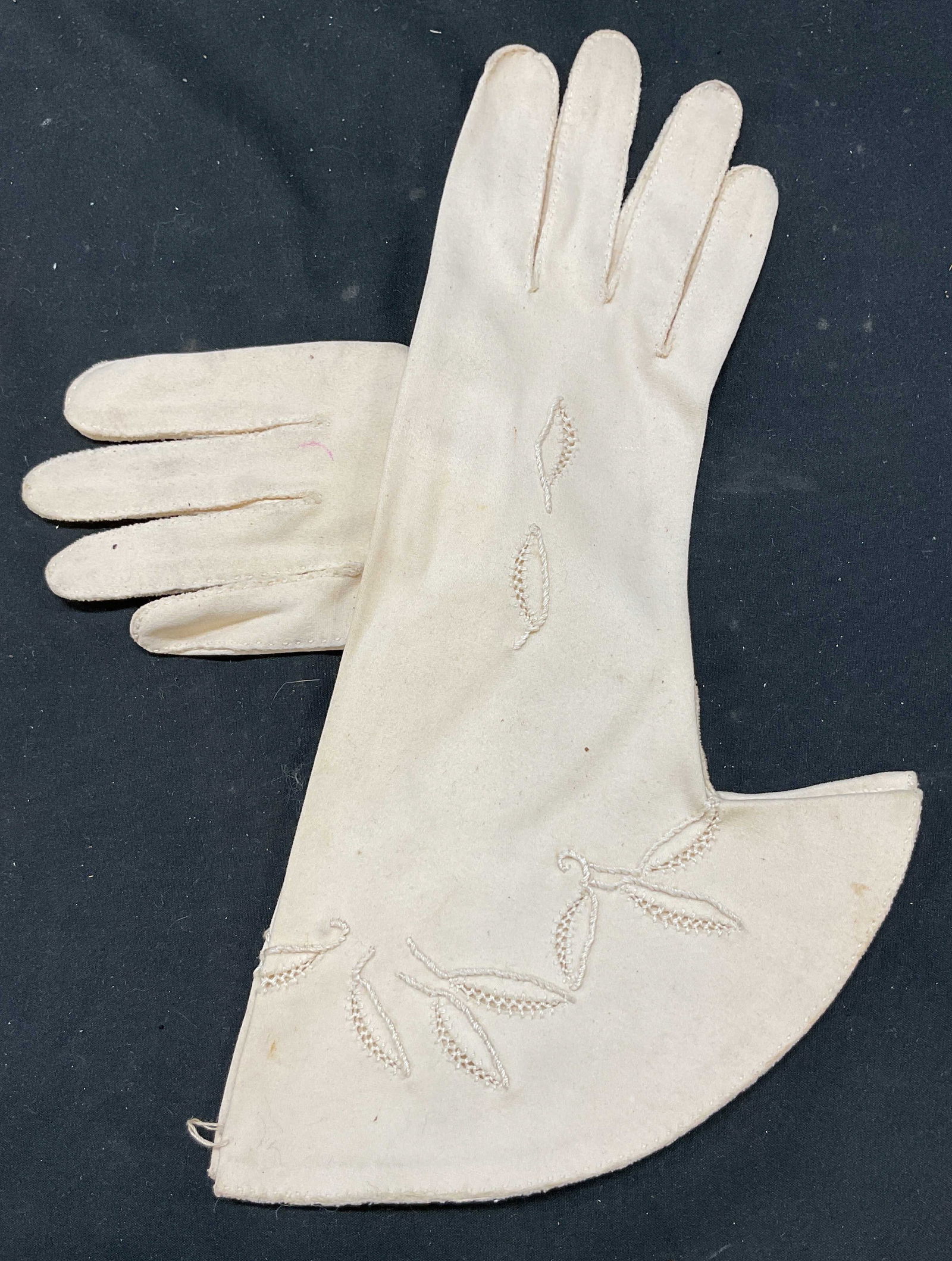 Wear Right Beige Suede Bell Sleeve Gloves USA: Wear Right beige suede bell sleeve gloves. Made in USA. Open work embroidery. Beige suede gloves hand stitching around fingers. On trim and sleeve top of glove flared bell shape. Inside glove original