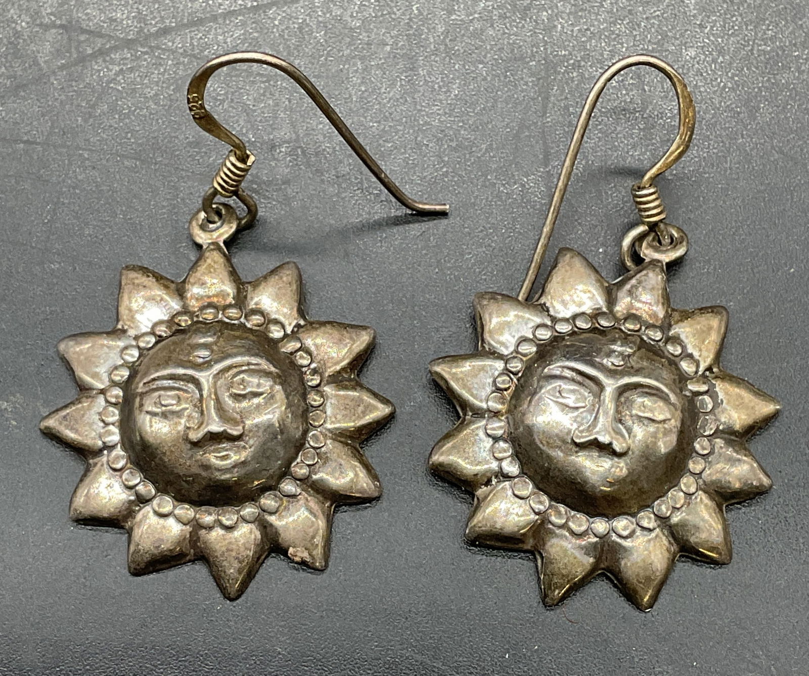 Vintage Sterling Silver Sun Face Earrings: Vintage sterling silver sun face motif earrings. Measure approx .75 inches wide. Total weight 3.4 grams. Test for sterling using acid test. Some scratching. Jewelry, estate jewelry, fine jewelry, cock