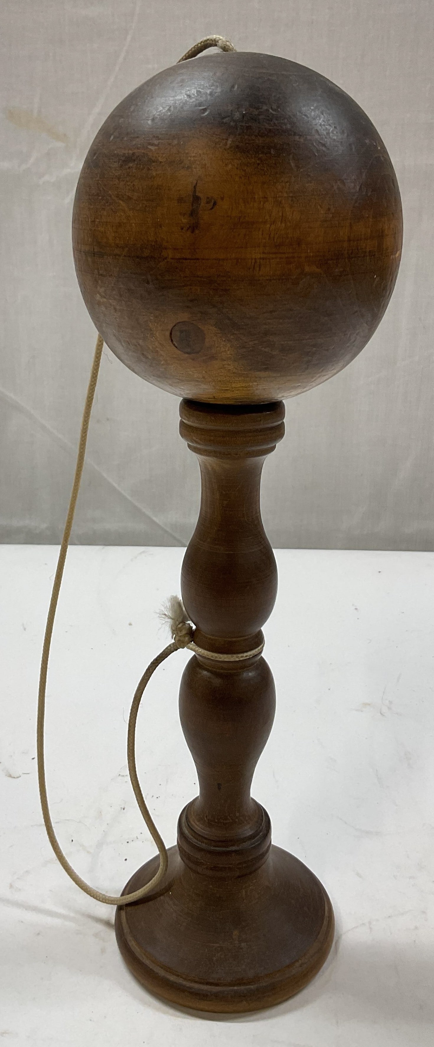 Antq French Olive Wood Oak Bilboquet Game On Stand: Antique French olive wood and oak Bilboquet game on stand. Late 19th early 20th century toy. Hand made, marked on underside reads as follows made in France. Turned wood handle and ball attached by str