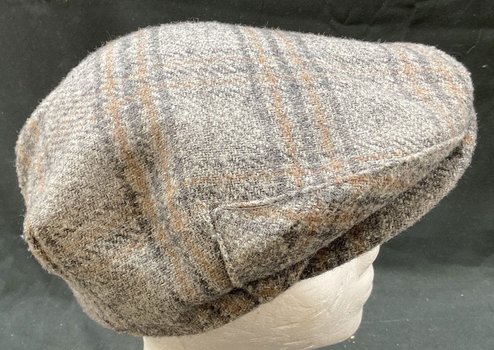Imported Fabric Plaid Tweed Flat Cap England: Imported Fabric plaid tweed flat cap. Interior tags read as follows Imported Fabric Woven In England, Style Club Charter Member Made In USA? Of Course. Inside tag reads size Small. Plaid tweed design