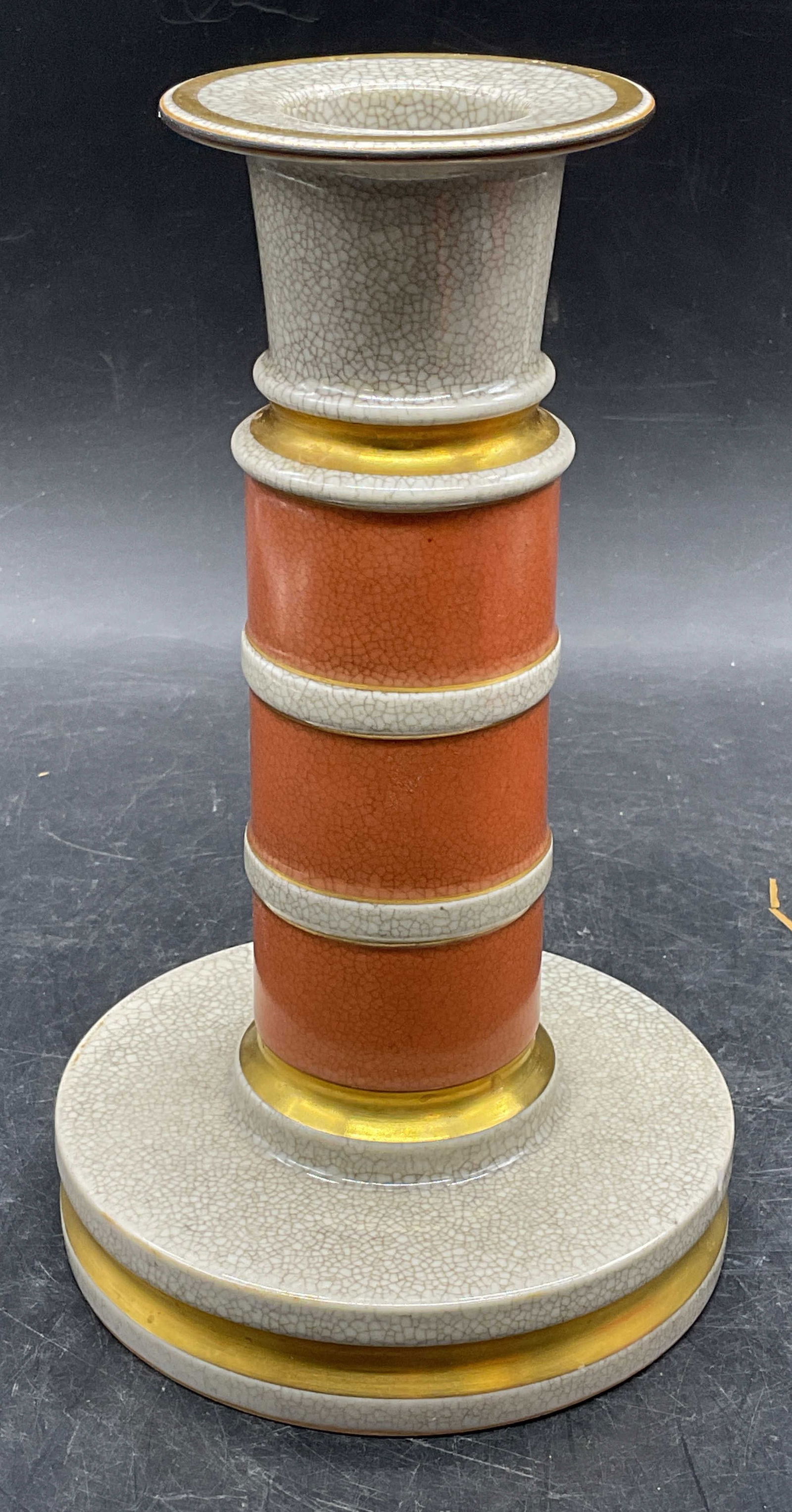Royal Copenhagen Crackle Crmc Candlestick Denmark: Vintage mid century modern Royal Copenhagen ceramic candlestick. Crackle glaze with orange and gilt bands. Wide base and flared rim. Signed. Made in Denmark. Measures approx 4.25 x 7.25 inches. Some s