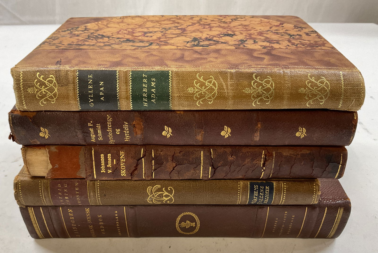 Lot 5 Antq Leather & Gilt Bks 1900s Adams+: Lot of 5 books. Antique leather bound gold embossed marbled books. Gyllene Apan, Herbert Adams published by Ahlen & Soners Publishing, 1933. Hyrdedrenge Og Hyrdeliv, August F. Schmidt published by J.