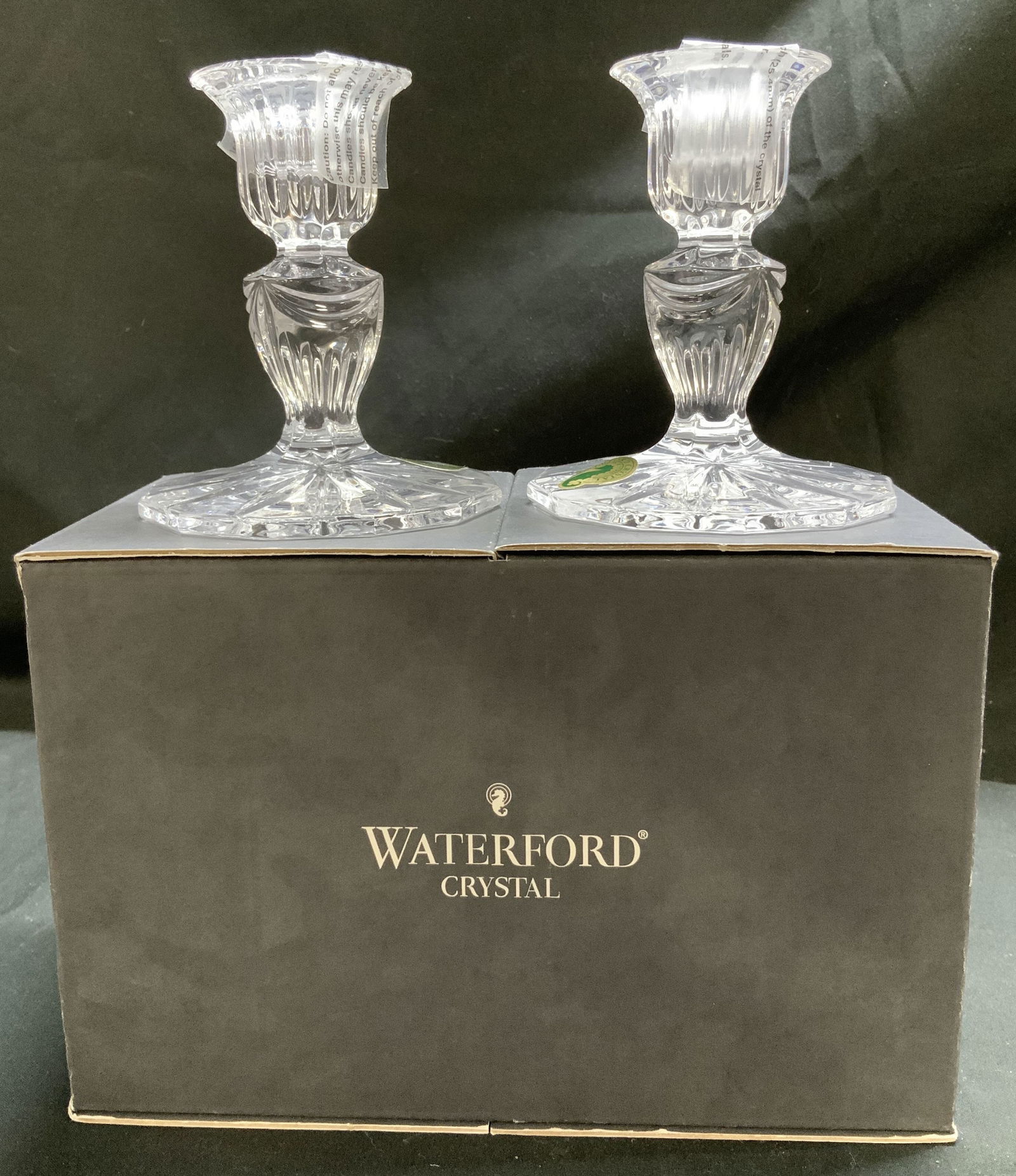 Pr Waterford Crystal Prentiss Candlesticks AUSTRIA: Lot includes, pair Waterford crystal clear candlesticks featuring intricate faceting & a starburst design on base. Comes with original box. Signed & marked. Reads, Waterford Crystal. Austria. Surface
