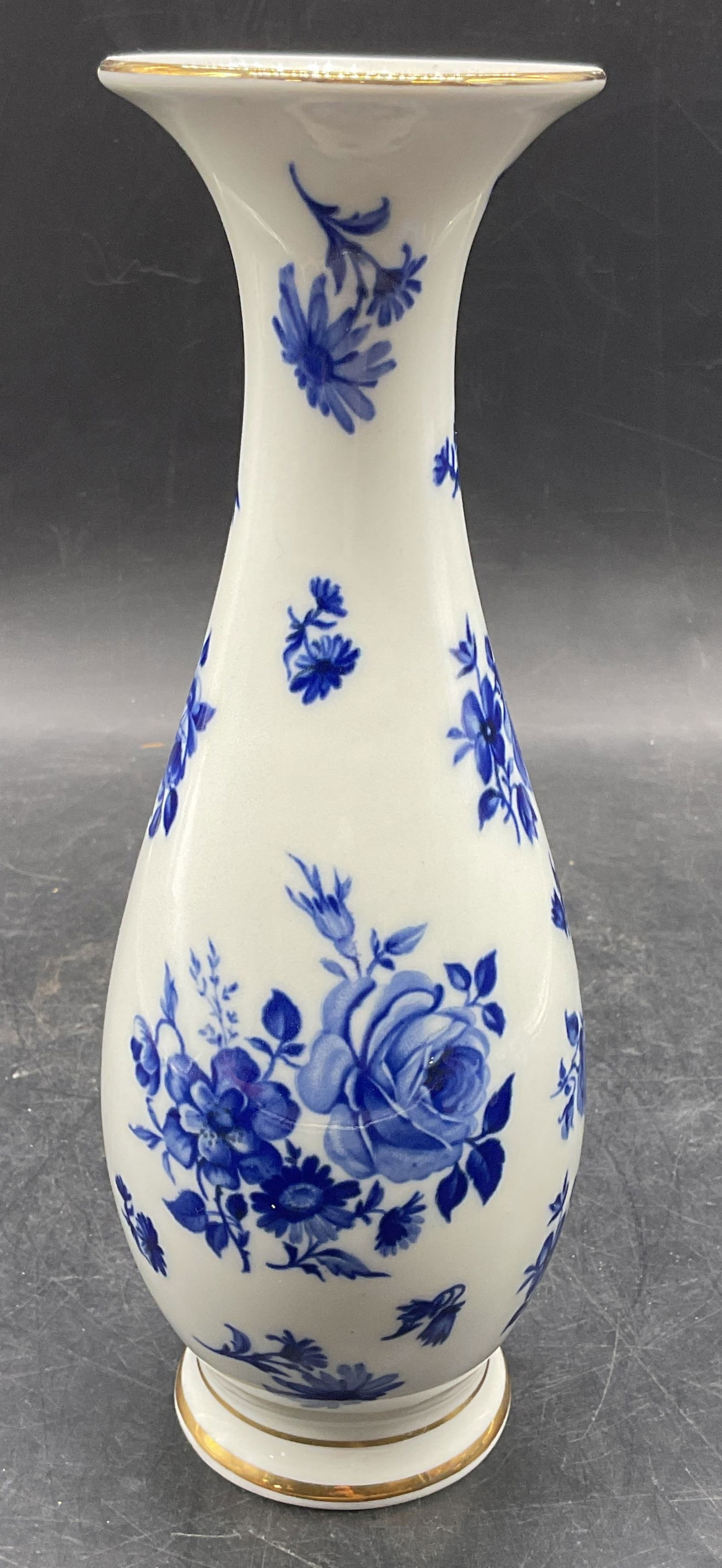 KPM Blue & White Porcelain Flower Vase, Germany: Signed KPM Royal Porzellan Bavaria vase. Hand painted blue and white flower design. Rounded bowl with fluted rim. Measures approx 3 x 9.25 inches. Made in Germany. Some scratching. KPM vase, blue and