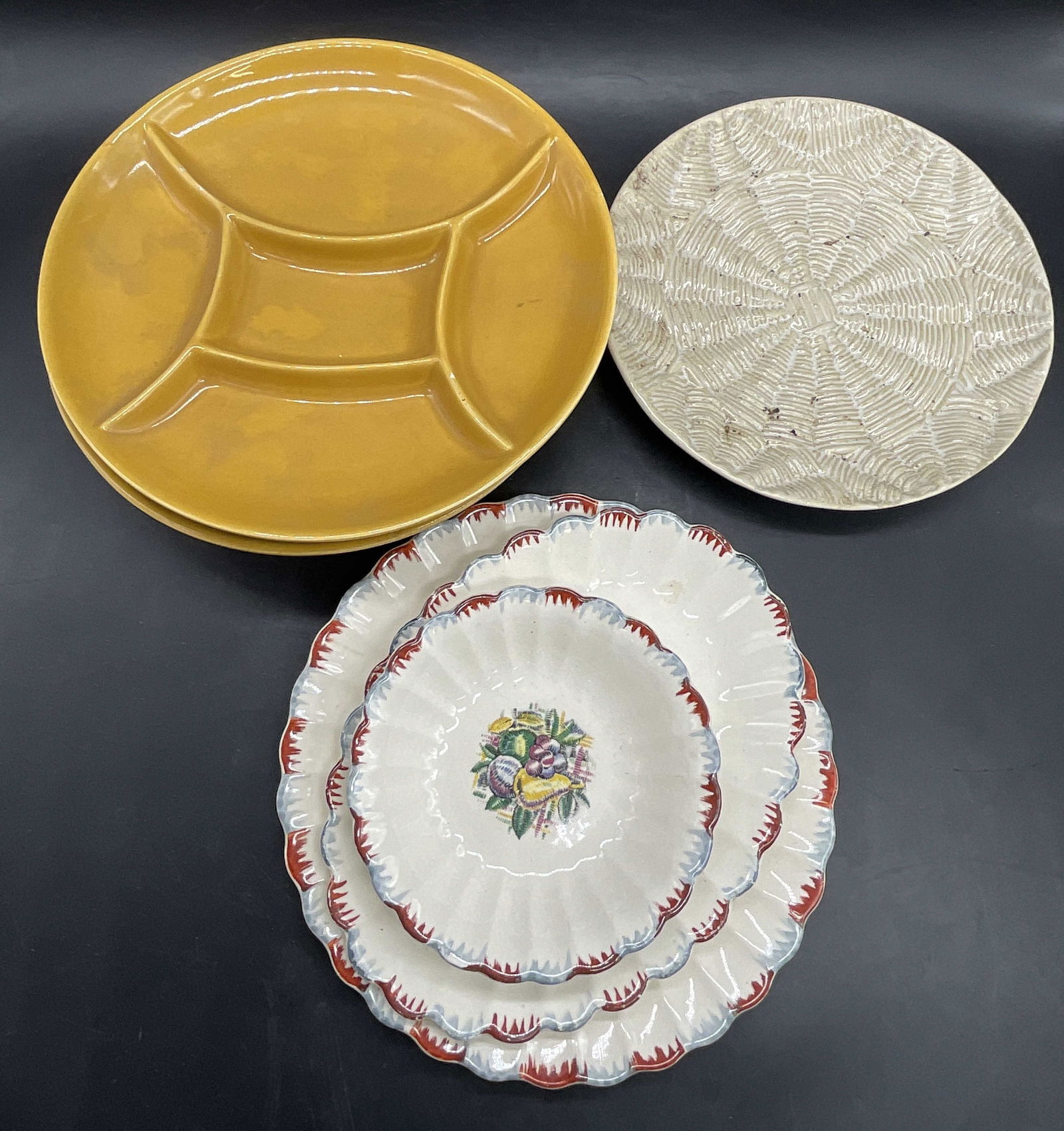 Lot 7 Vintage Ceramic Tableware, Dishes & Bowls: Lot 7 Vintage Ceramic Tableware. Includes Dishes and Bowls. Yellow segmented dish appears to be marked or signed on the underside, illegible. Some dishes feature fruit motifs. Textured ceramic dish me