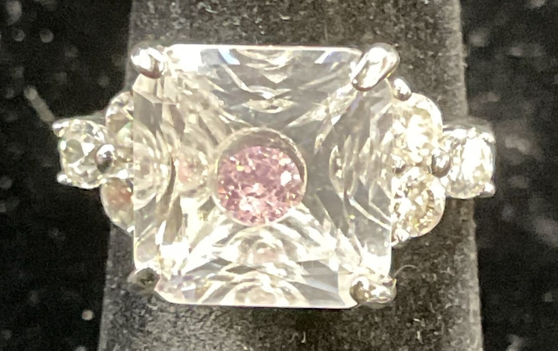 Signed Sterling Silver Pink Semiprecious Ring: Signed Sterling silver ring with colorless and pink semiprecious stones. Marked sterling. Size 5. Total weight 5.6 grams. Some scratching. Jewelry, estate jewelry, fine jewelry, cocktail jewelry, fash