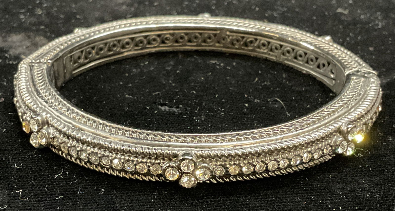 Silver Tone Crystal Bangle Bracelet: Silver tone hinged bangle bracelet with colorless crystals. Measures approx 2.5 inches wide. Some scratching. Jewelry, estate jewelry, costume jewelry, cocktail jewelry, fashion jewelry, accessories,