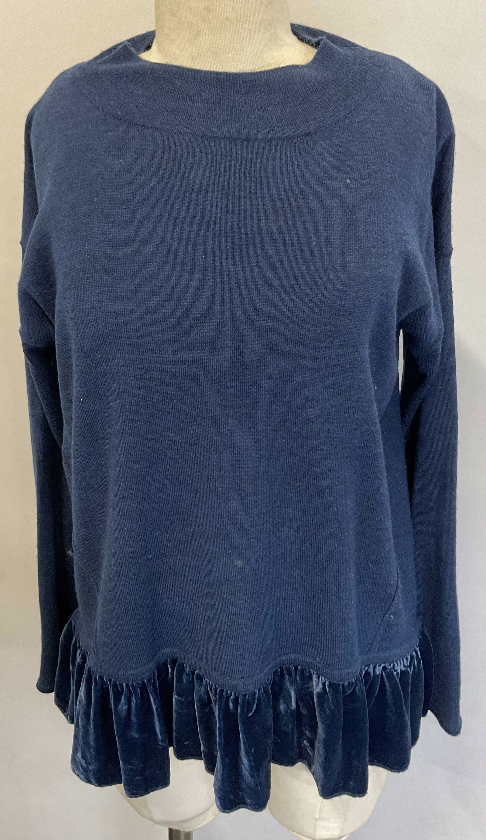 Wrap London Blue Ruffled Trim Sweater: Wrap London blue ruffled trim sweater. Size 8. Merino material. Trim is rayon and silk material. Ruffled blue trim. Ribbed texture. Split seam in back. Holes and blemishes observed. Wear