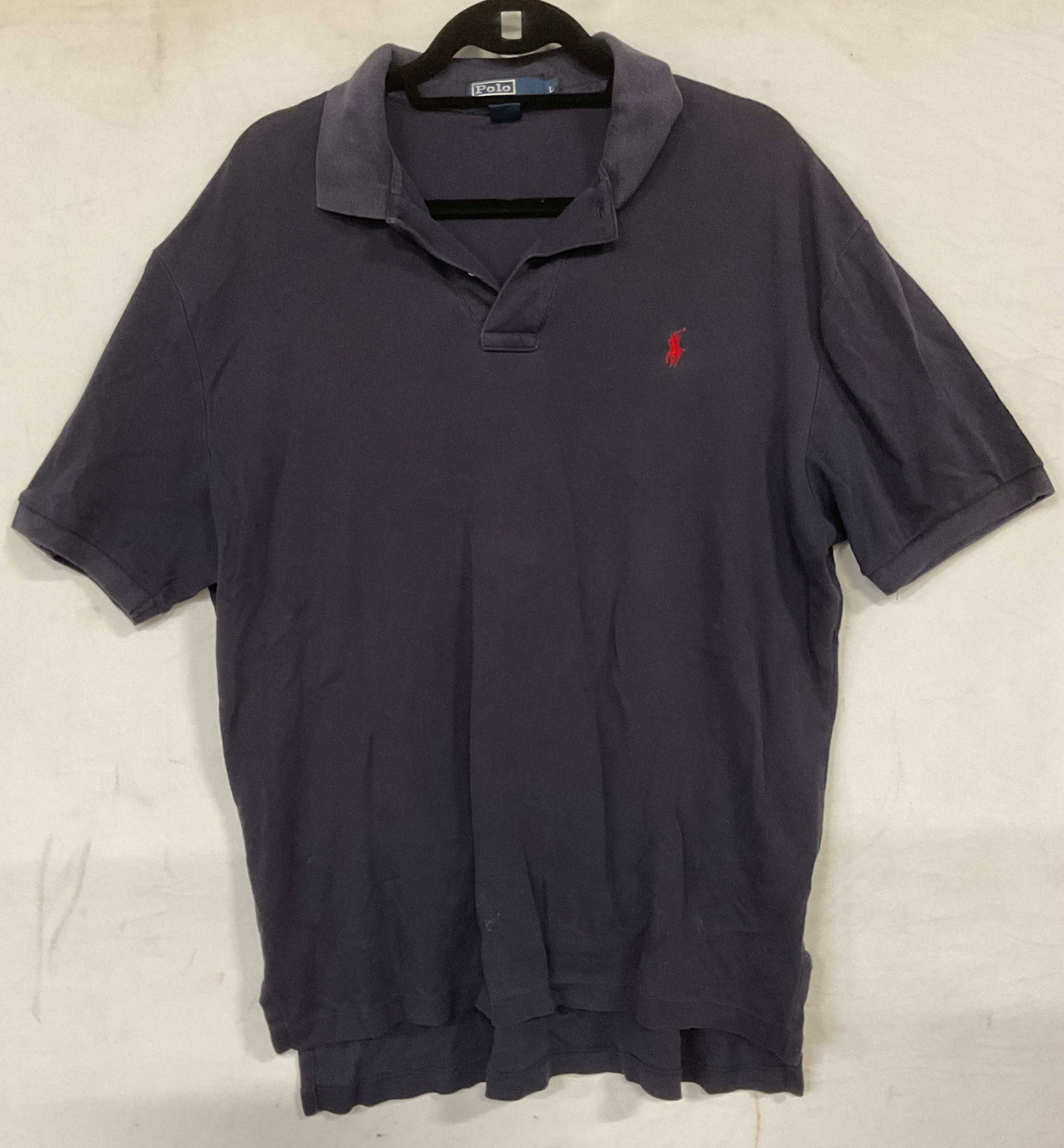 Ralph Lauren Polo Blue Cotton Polo Shirt: Ralph Lauren Polo navy blue cotton short sleeve polo shirt. Size large. Some wear consistent with exposure. Ralph Lauren polo, polo shirt, designer shirt, mens shirt, mens fashion, designer fashion, b