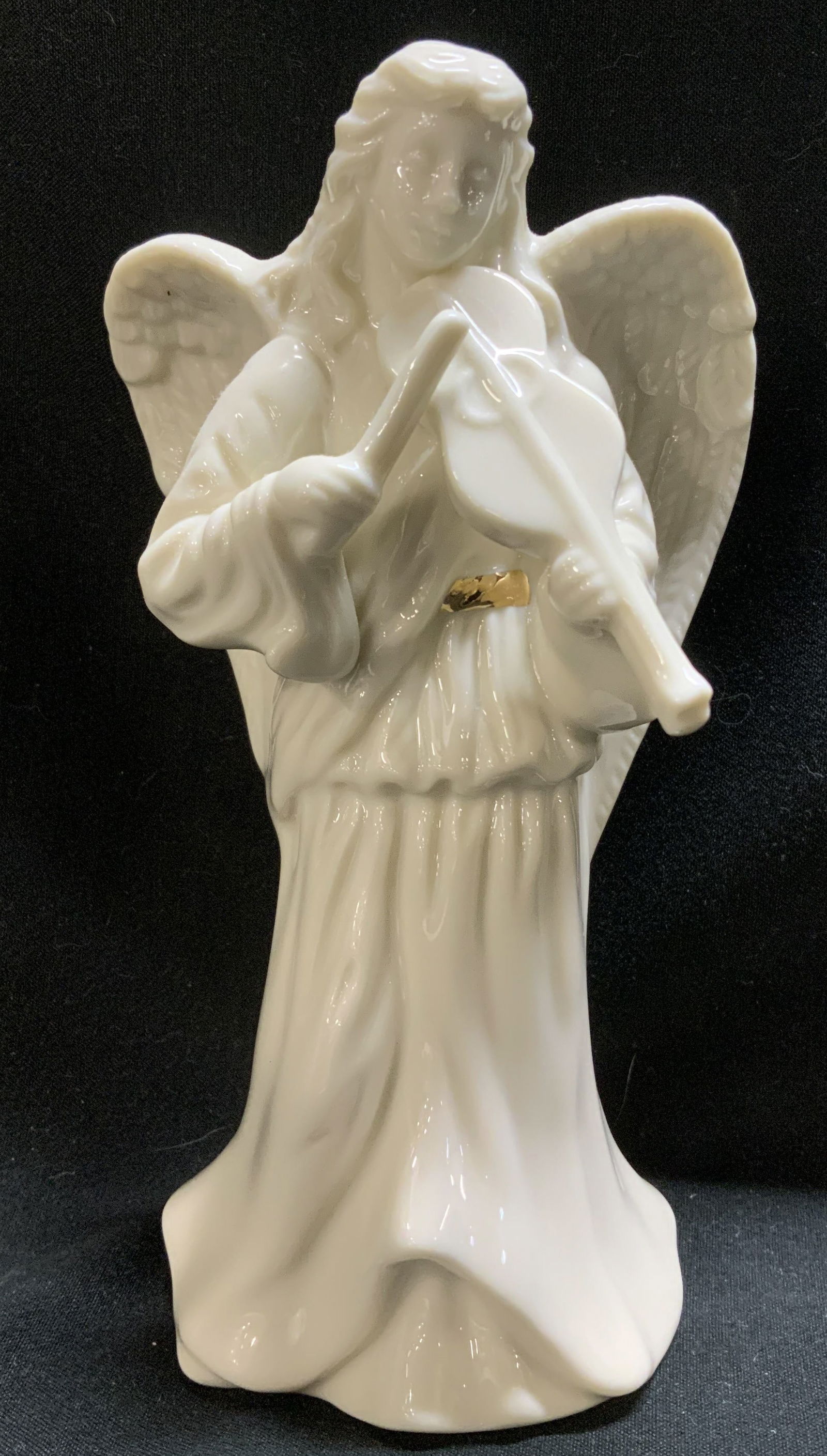 Lenox Angel Playing Violin Porcelain Figurine: Porcelain figurine depicts an angel playing a violin. Angel has gilt accents. Glossy finish. Signed & marked on underside. Reads, LENOX. Surface wear consistent to age, use & exposure. Measurements: l