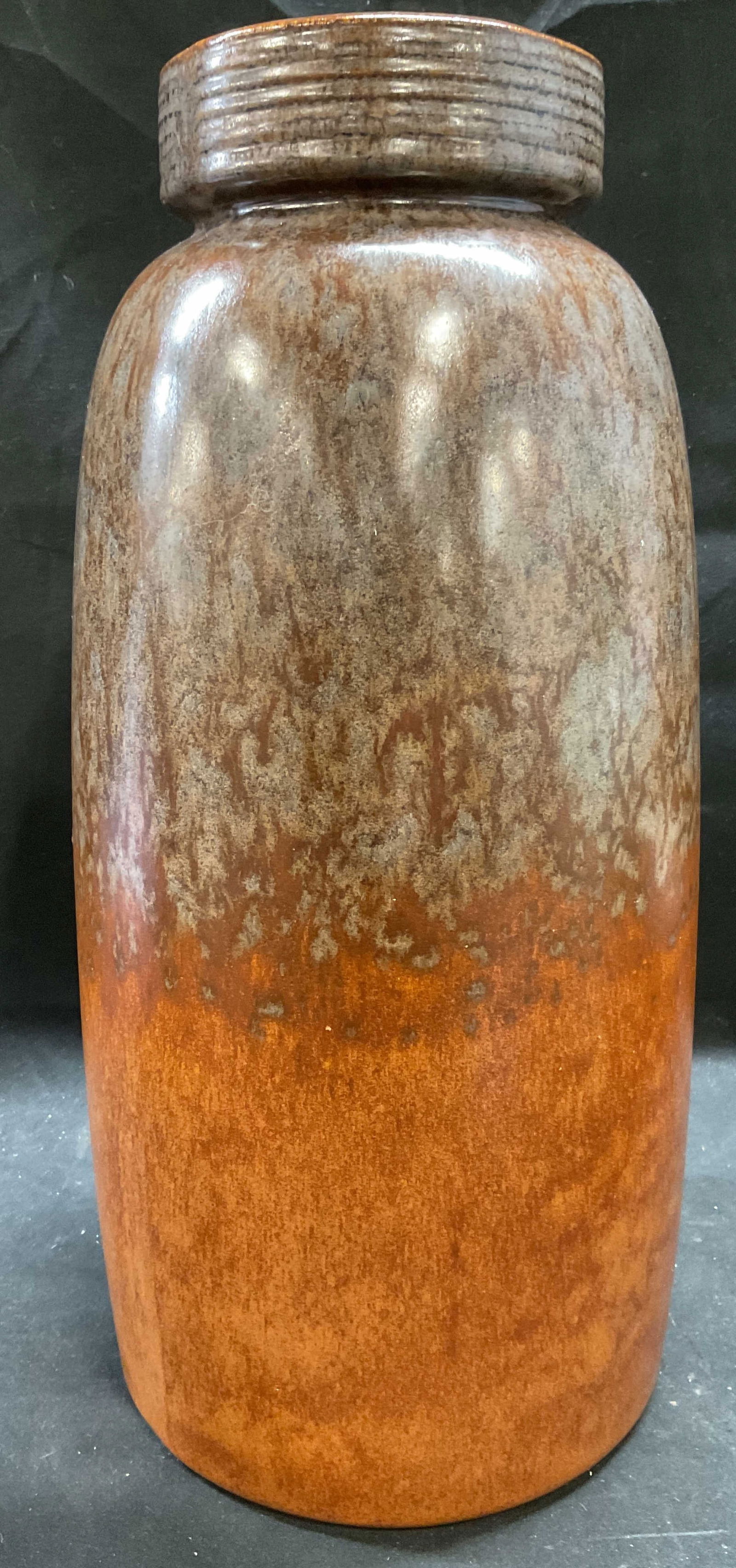 Vintage German Brown Salt Glaze Ceramic Vase: Vintage brown salt glazed ceramic vase. Two toned. Hand painted. Conical shaped vessel with ribbed textured rim. Marked West Germany, 553-38. Measures approx 6.5 x 15 inches. Some wear consistent with