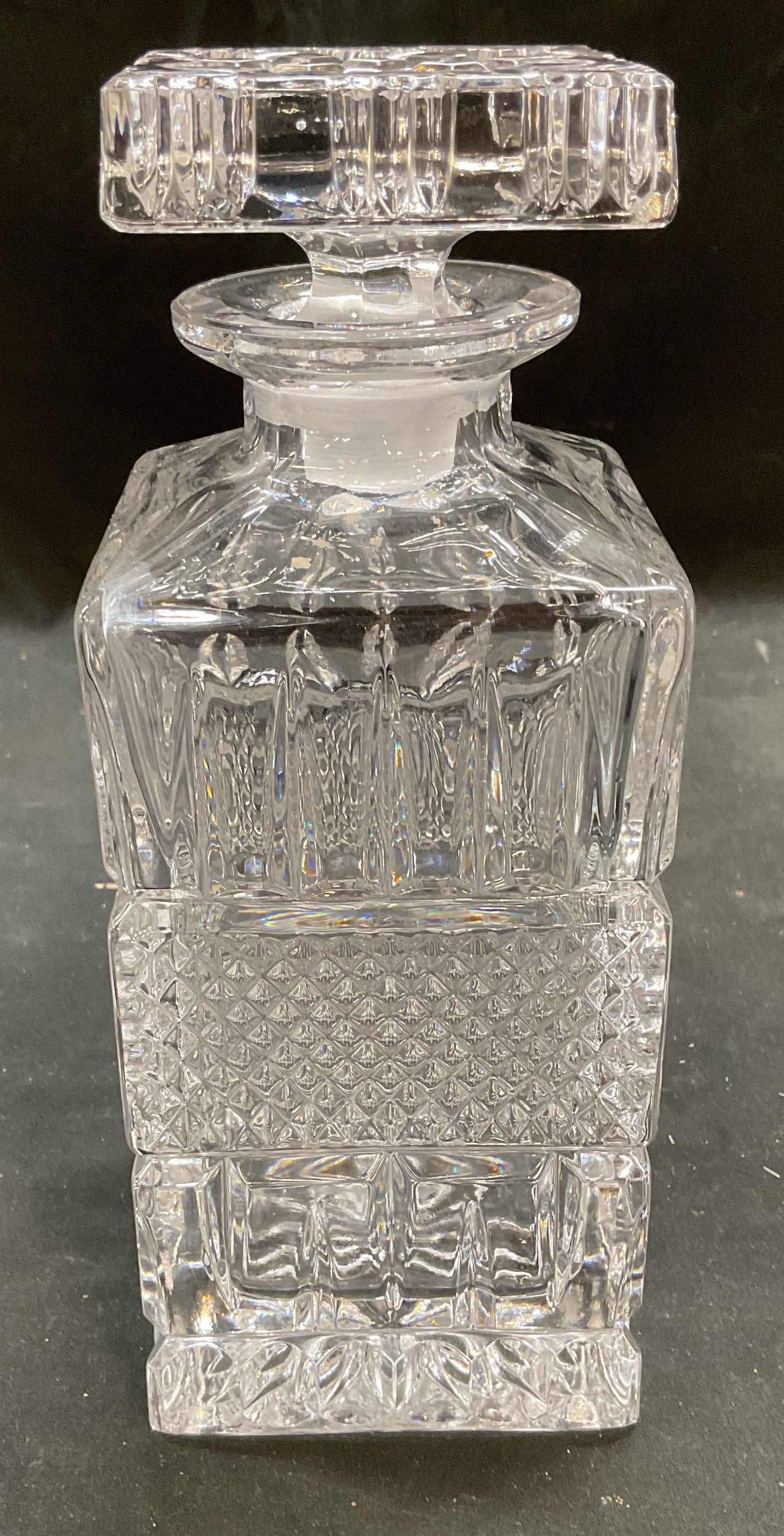 Heavy Cut Crystal Square Diamond Decanter: Cut crystal square shaped decanter with stopper. Diamond and notched pattern. Thick walled crystal, piece has weight. Measures approx 3.5 x 3.5 x 8.5 inches. Some scratching. Decanter, crystal decante