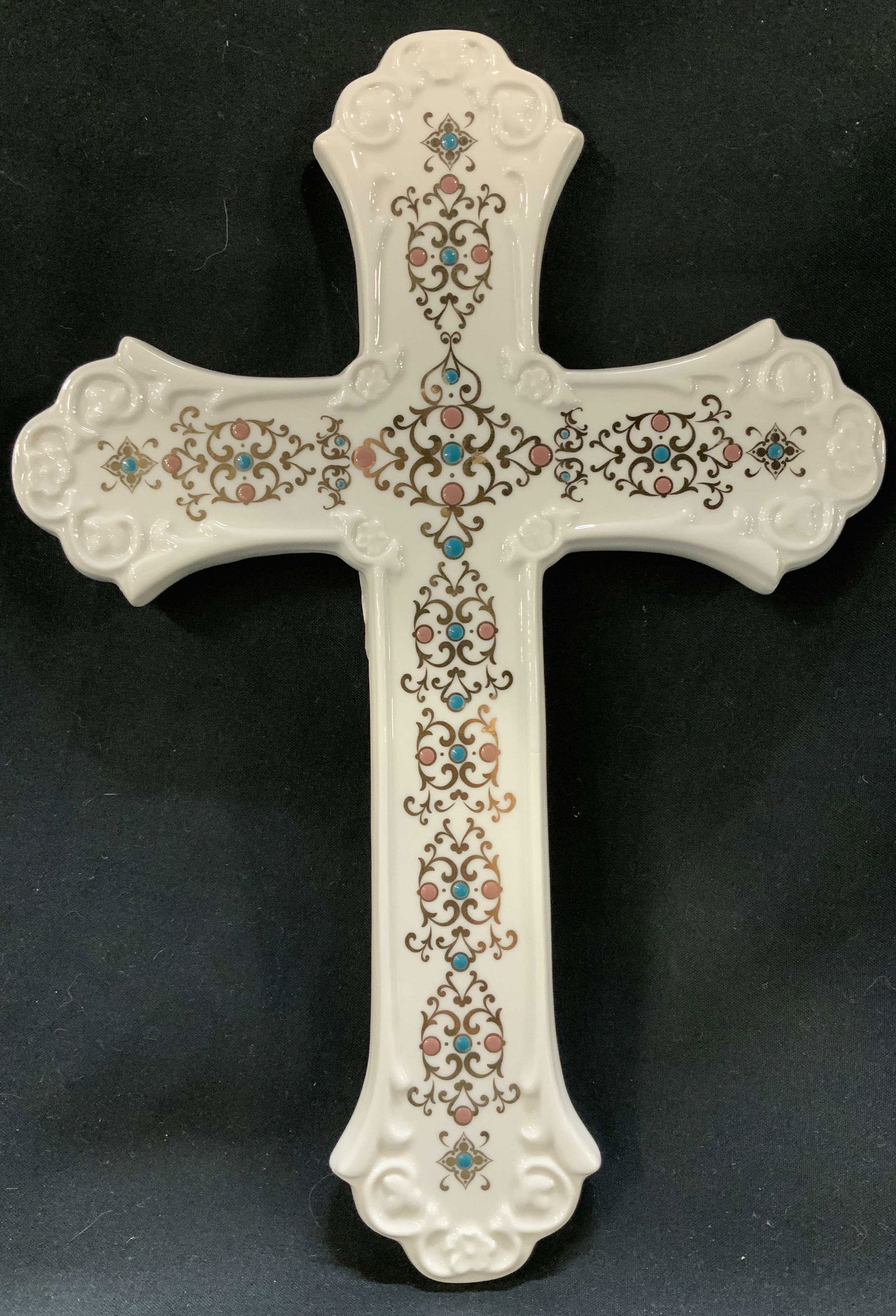 Lenox China Jewels Collection Cross 10in: Lenox china jewels collection cross features multi-colored blue & pink accents. Gilt scrollwork throughout cross. Glossy finish. Signed & marked. Reads, LENOX CHINA JEWELS COLLECTION. LENOX AMERICA BY