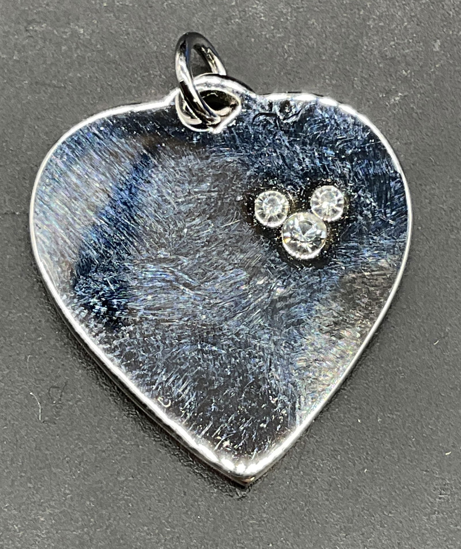 Disney Sterling Silver Crystal Heart Pendant: Signed Disney sterling silver and crystal accented Mickey Mouse head heart pendant. Marked sterling. Measures approx 1 x 7/8 inches. Total weight 6.2 grams. Some scratching. Jewelry, estate jewelry, f