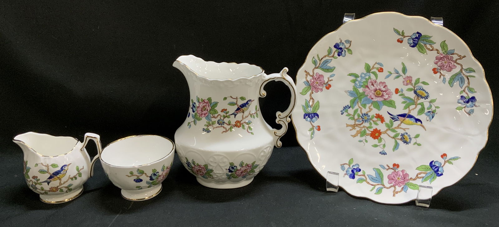 4 Aynsley Pembroke Plate, Cream, Pitcher, Bwl Eng: Lot includes, 1 scalloped plate, 1 creamer, 1 pitcher & 1 mini open sugar bowl. Pieces are fine English bone china & feature bird/floral motifs. Gilt accents on trim. Signed & marked. Reads, EST. 1775