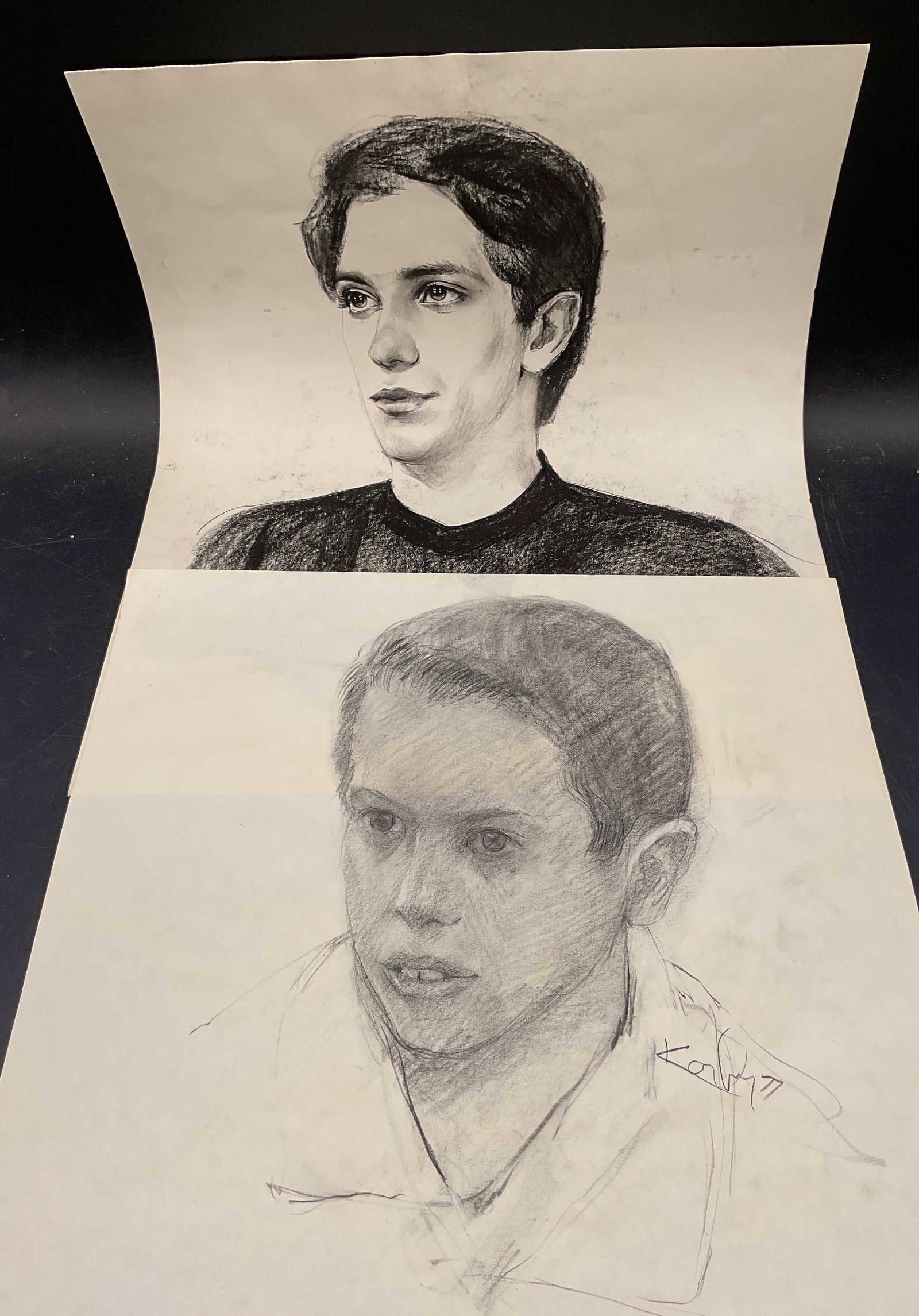Lot 2 Signed Male Portrait Drawings & Frame: Lot of 2 signed male portrait drawings on paper. Signed illegibly. Dated 1977 and 1988. Includes acrylic frame. Paper measures approx 17 x 14 inches. Property of Upper East Side French stage and scree