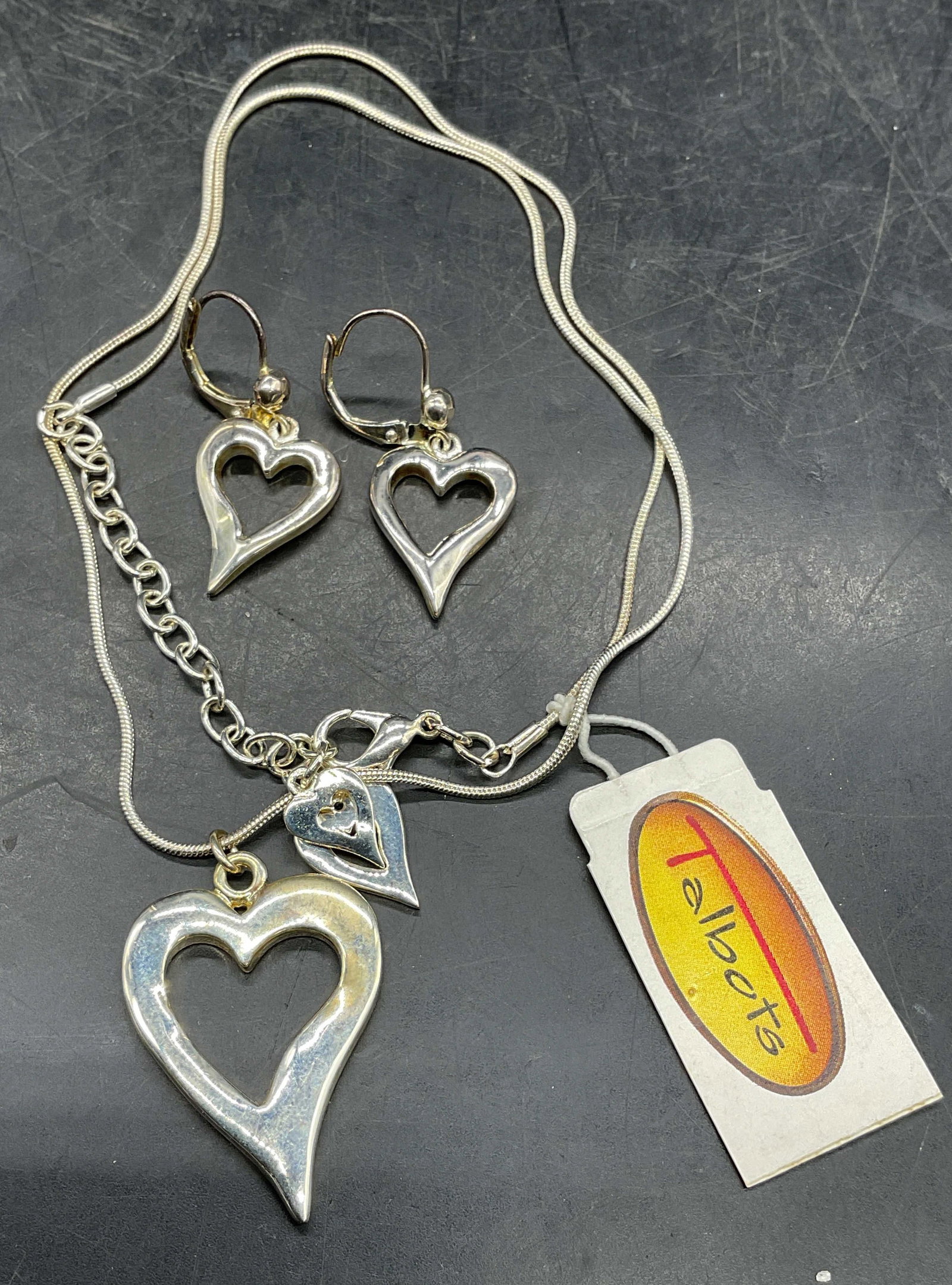 2 Talbots Silver Tn Heart Necklace & Earrings NWT: Lot of 2 Talbots matching silver tone jewelry pieces. Heart pendant necklace and heart dangle earrings. Necklace new with tag. Signed on tag. Necklace drop length approx 9.5 inches. Earrings approx 1 