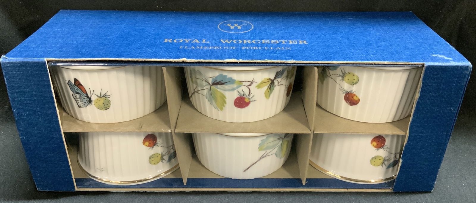 Set 6 Royal Worcester Strawberry Fair Ramekins NIB: Lot includes, set 6 of porcelain ramekins featuring hand-decorated fruit motifs. Comes in original box. Signed & marked. Reads, ROYAL WORCESTER. ENGLAND. STRAWBERRY FAIR. Surface wear consistent