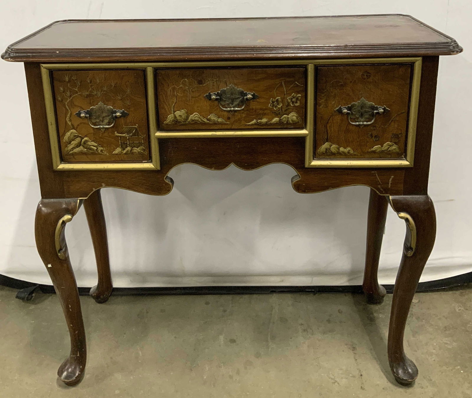 Vtg Hekman Chinoiserie Style Wooden Console Table: Chinoiserie style wooden console table features 3 pull out drawers adorned with intricate gilt floral, tree & hut accents. Curved cabriole style legs. Property of opera singers estate from the