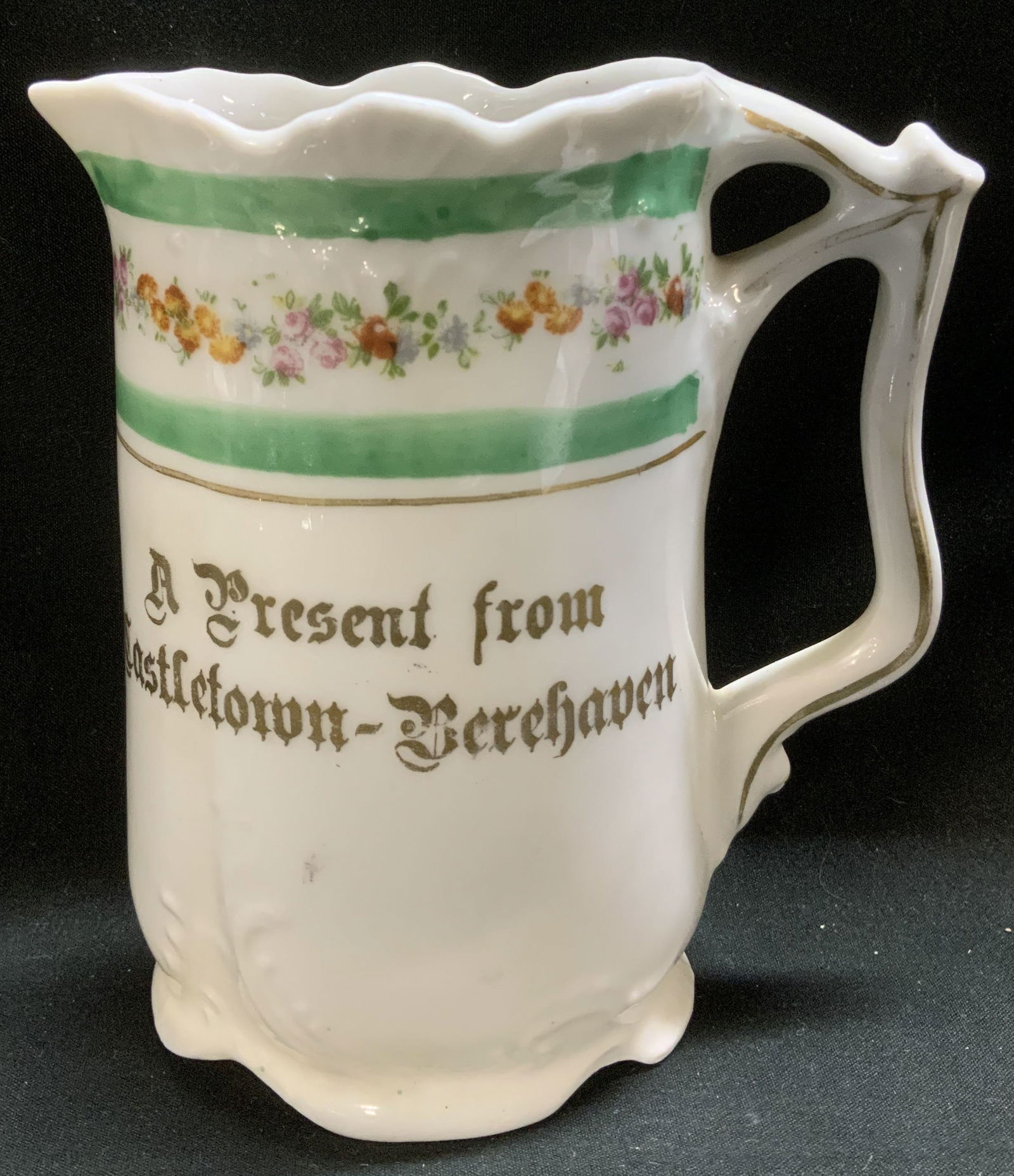 Vtg Souvenir Floral & Gilt Porcelain Creamer.: Vintage souvenir porcelain creamer from Castletown-Berehaven. Features a floral band & gilt accents. Surface wear consistent to age, use & exposure. Measurements: length 4.6in x width 2.5in x height 5