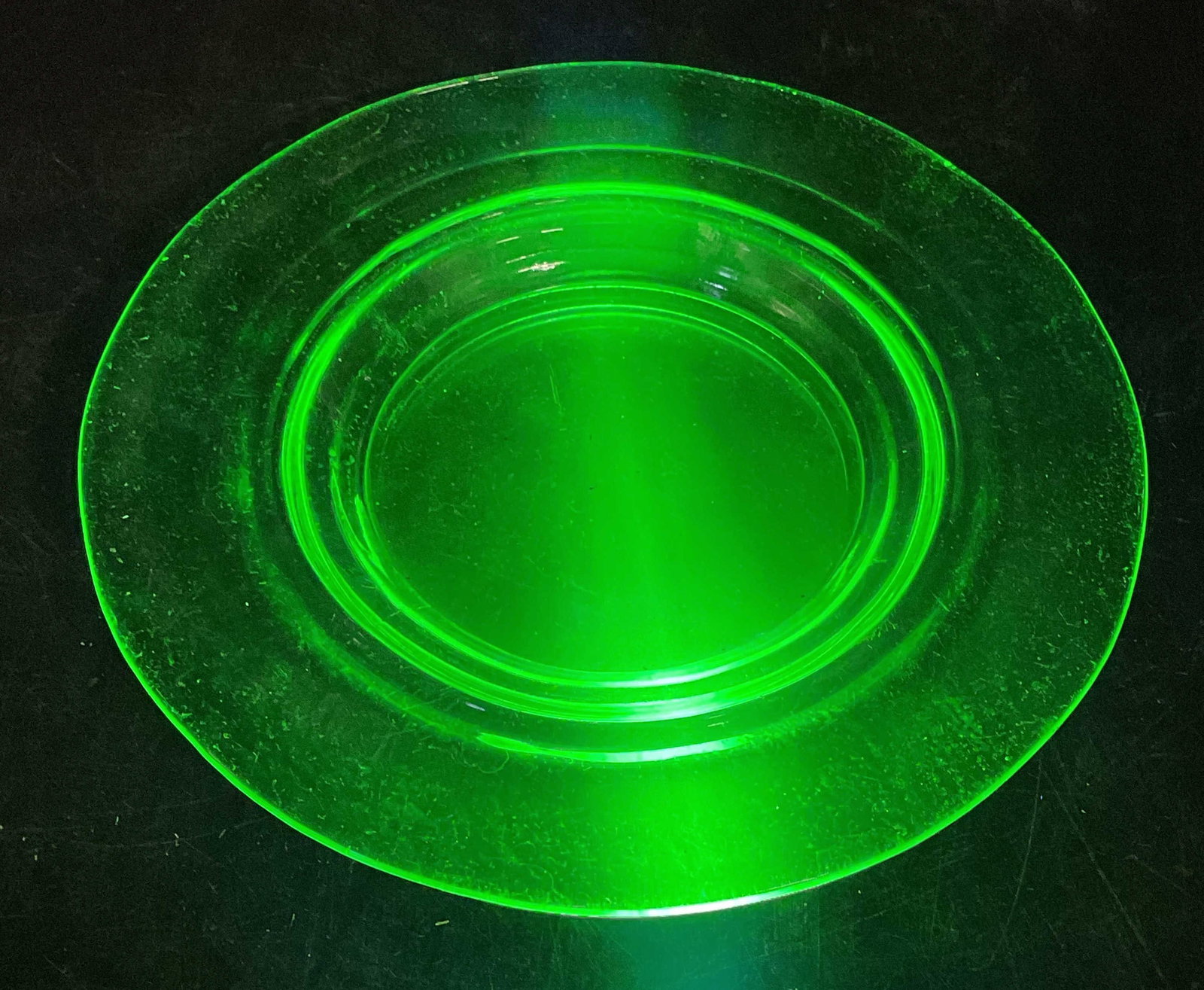 Vintage Green Uranium Glass Plate: Vintage uranium glass plate. Measure approx 6 inches wide. Glass is UV light reactive. Some scratching. Uranium glass, uranium glass plate, vintage uranium glass, collectibles, home decor, home access