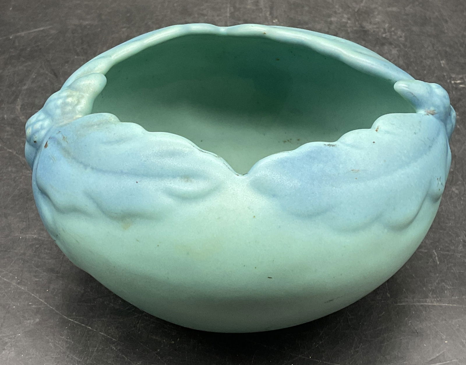 Van Briggle Arts & Crafts Ceramic Oak Leaf Bowl: Signed Van Briggle antique arts and crafts period ceramic bowl. Turquoise blue glazed with raised oak leaf and acorn pattern. Signed on underside, marked Col Springs. Measures approx 6 x 5.5 x 3.25 in